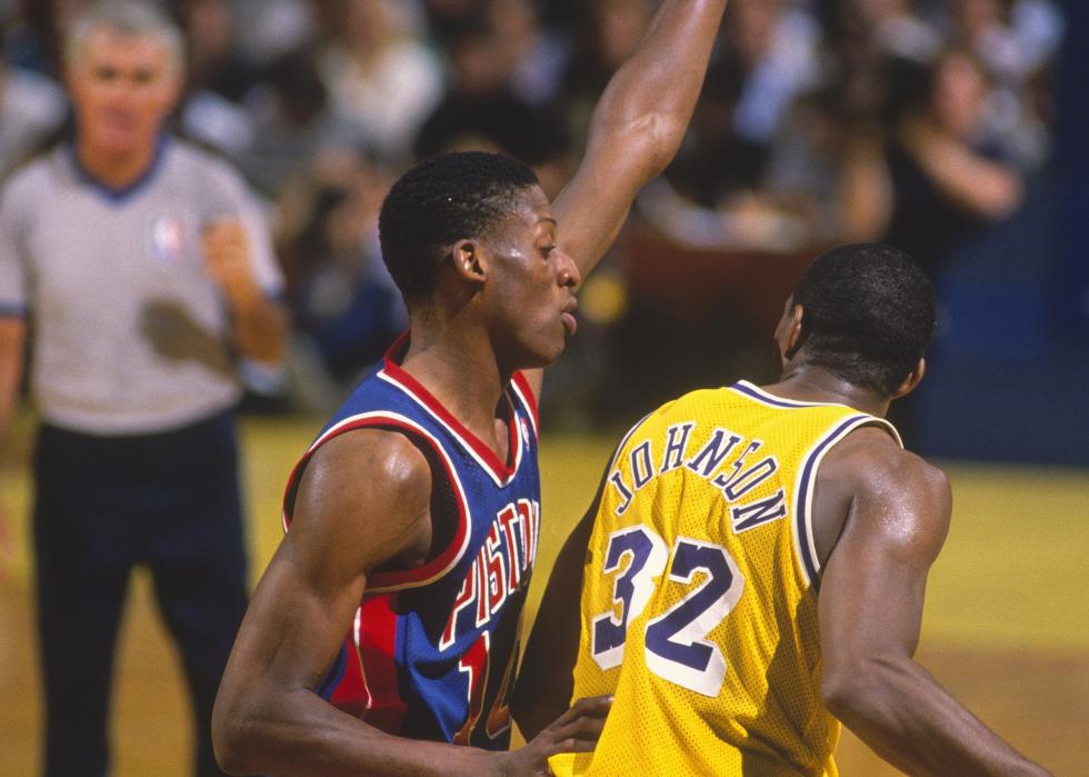 Dennis Rodman guards against the Lakers' Magic Johnson