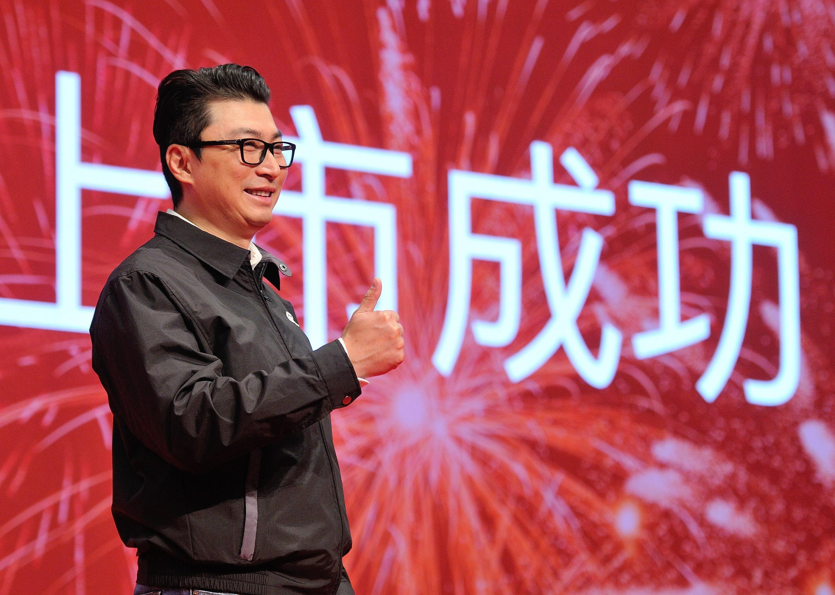 Wang Wei smiles at event.