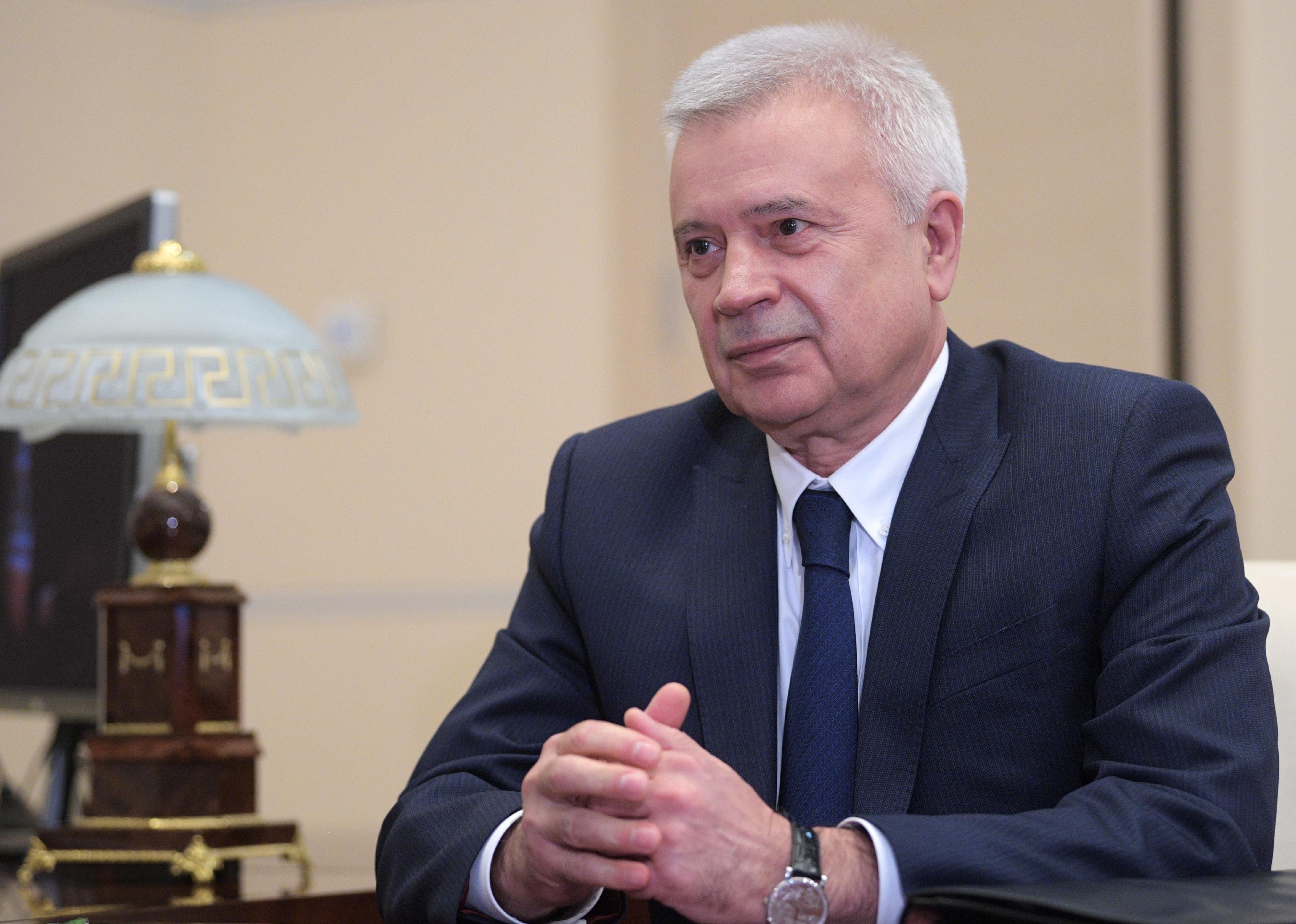 Vagit Alekperov sits at a desk. 