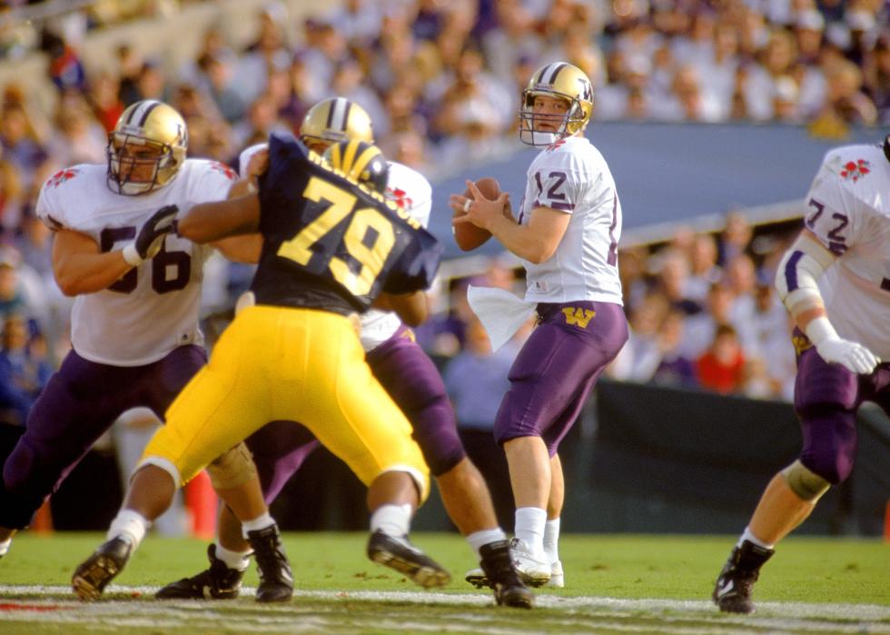 Quarterback Billy Joe Hobert of the Washington Huskies drops back to pass.