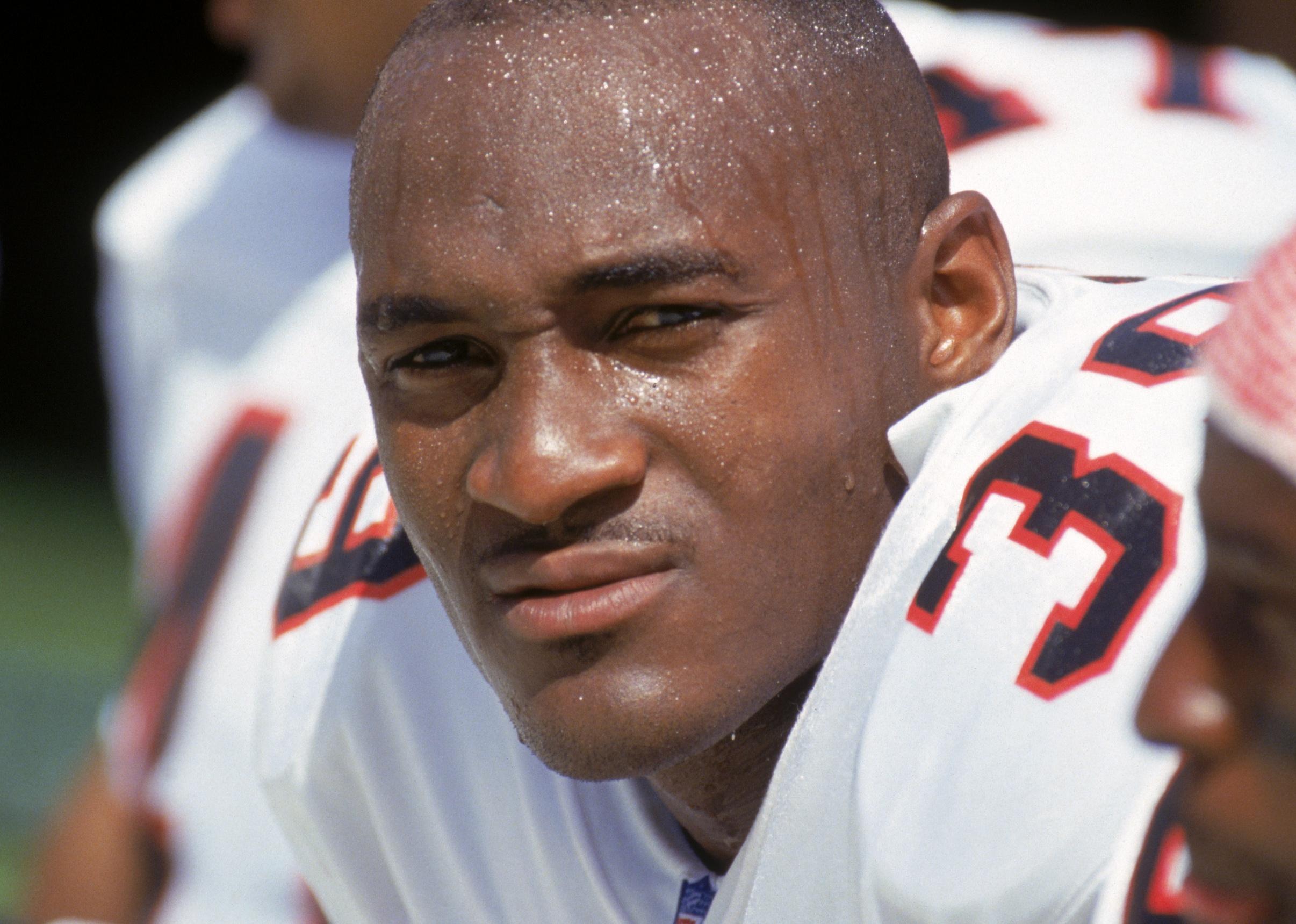 Cornerback Bruce Pickens of the Atlanta Falcons sits on the bench during a game.