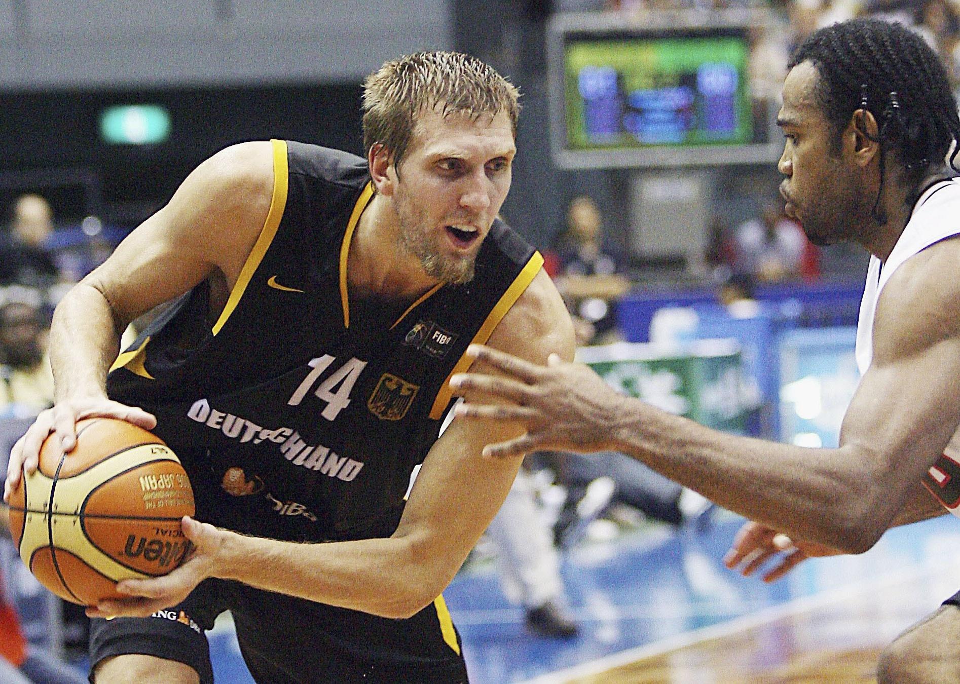 Dirk Kowitzki competes with Angola's Joaquim Gomes during a FIBA World Basketball World Championship.