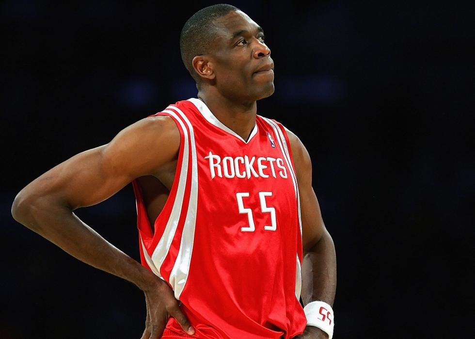 Dikembe Mutombo looks on against a game