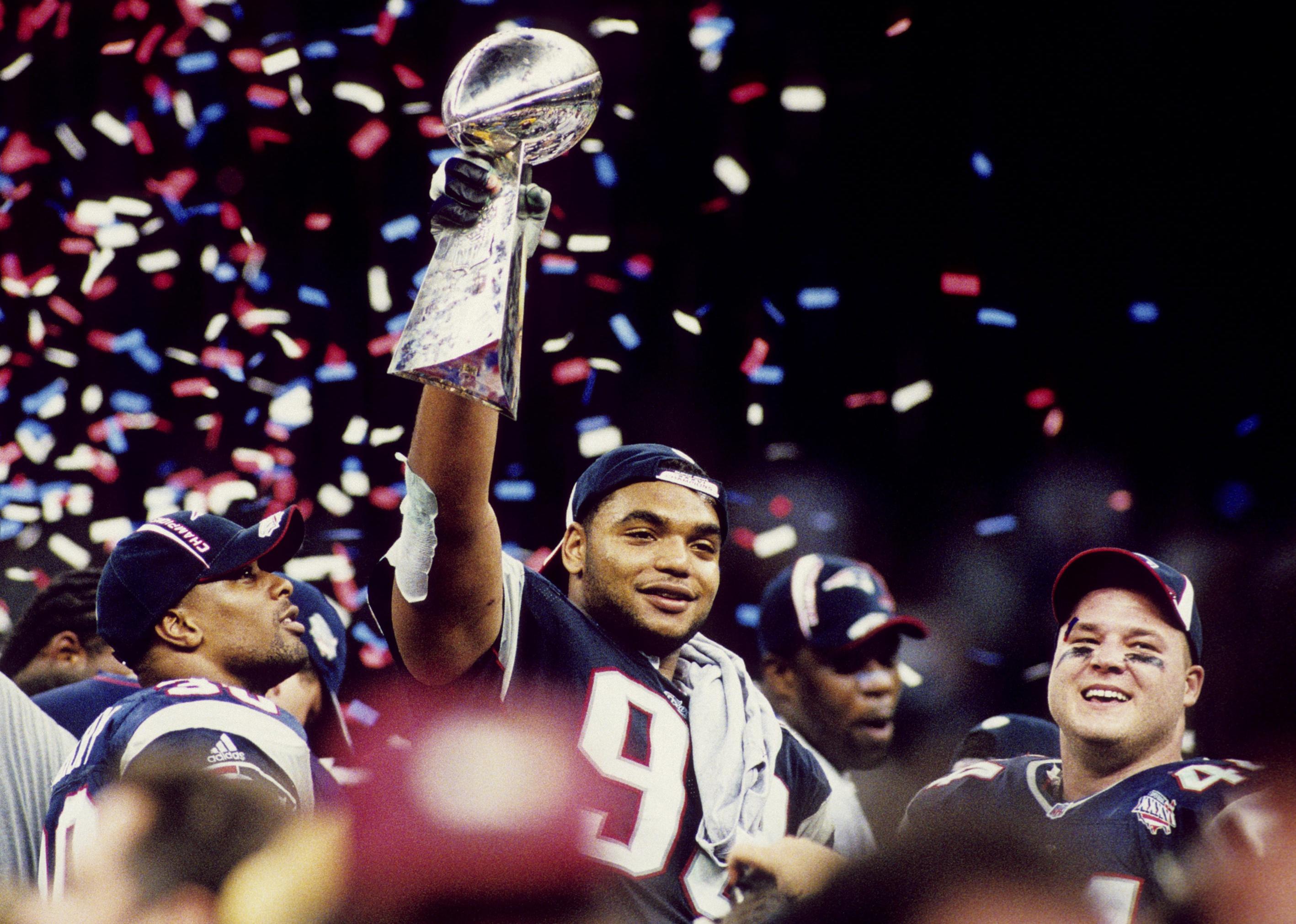 Richard Seymour hoists the Vince Lombardi Trophy.
