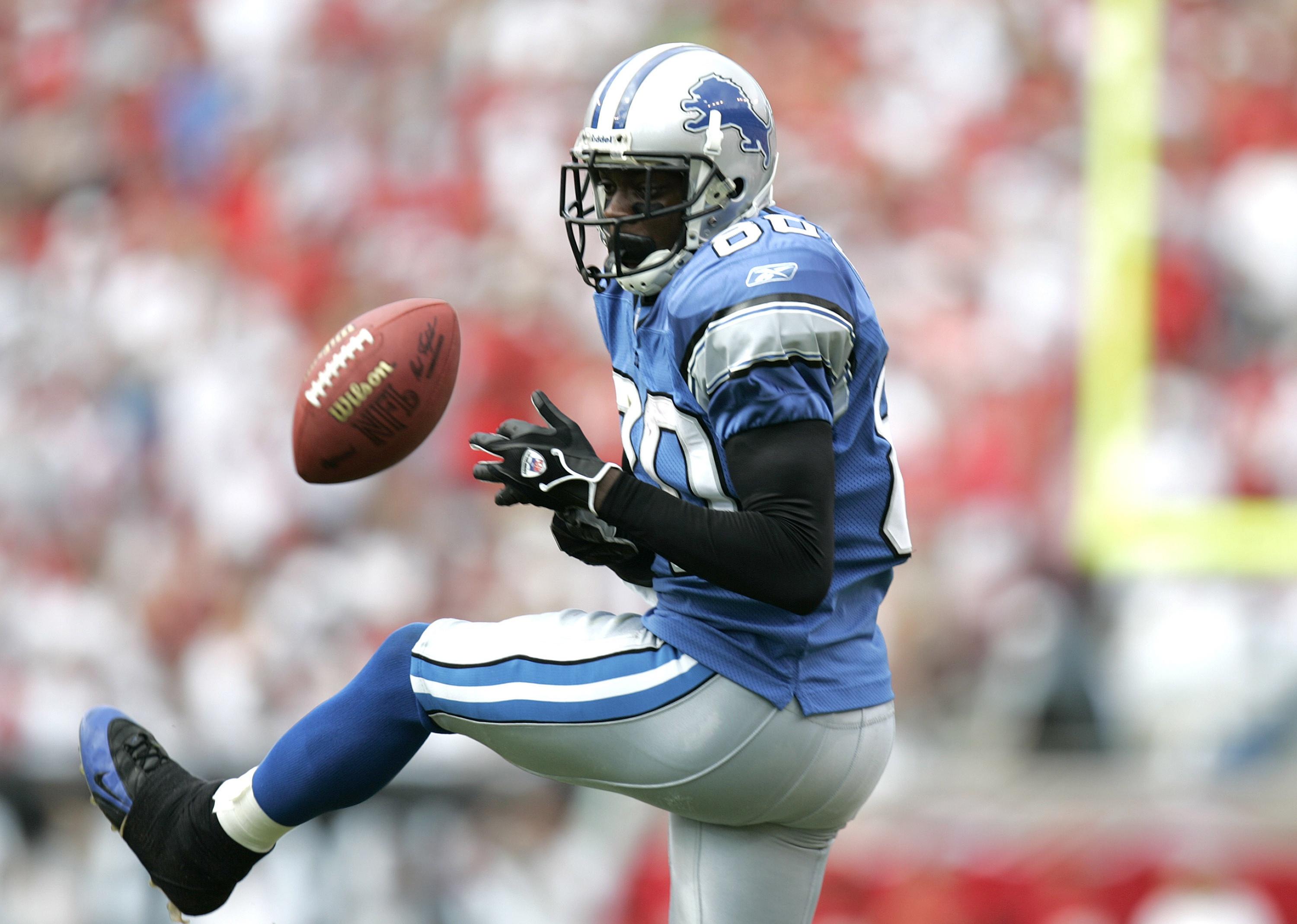 Charles Rogers drops a pass during a game.