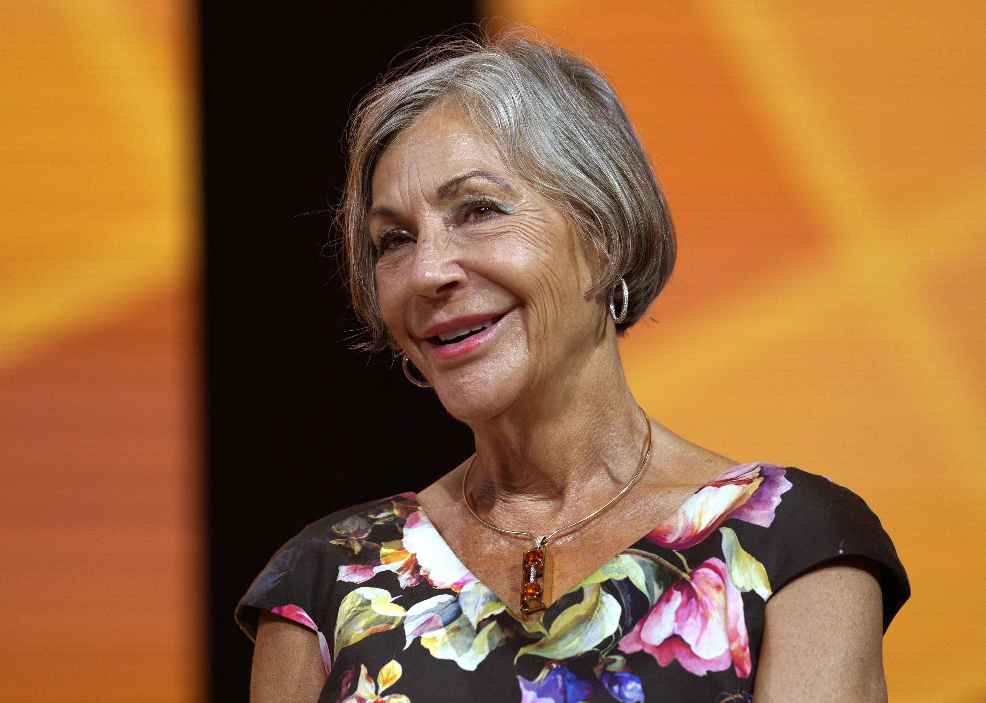 Alice Walton attends event.