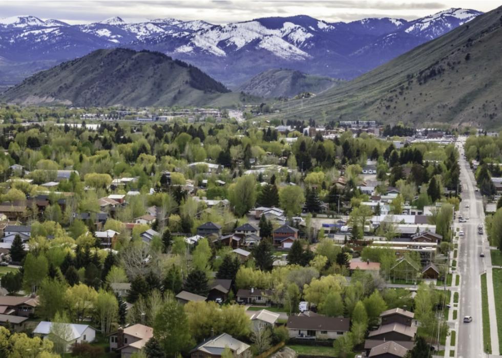Aerial view of homes in Jackson, Wyoming with mountains in background.