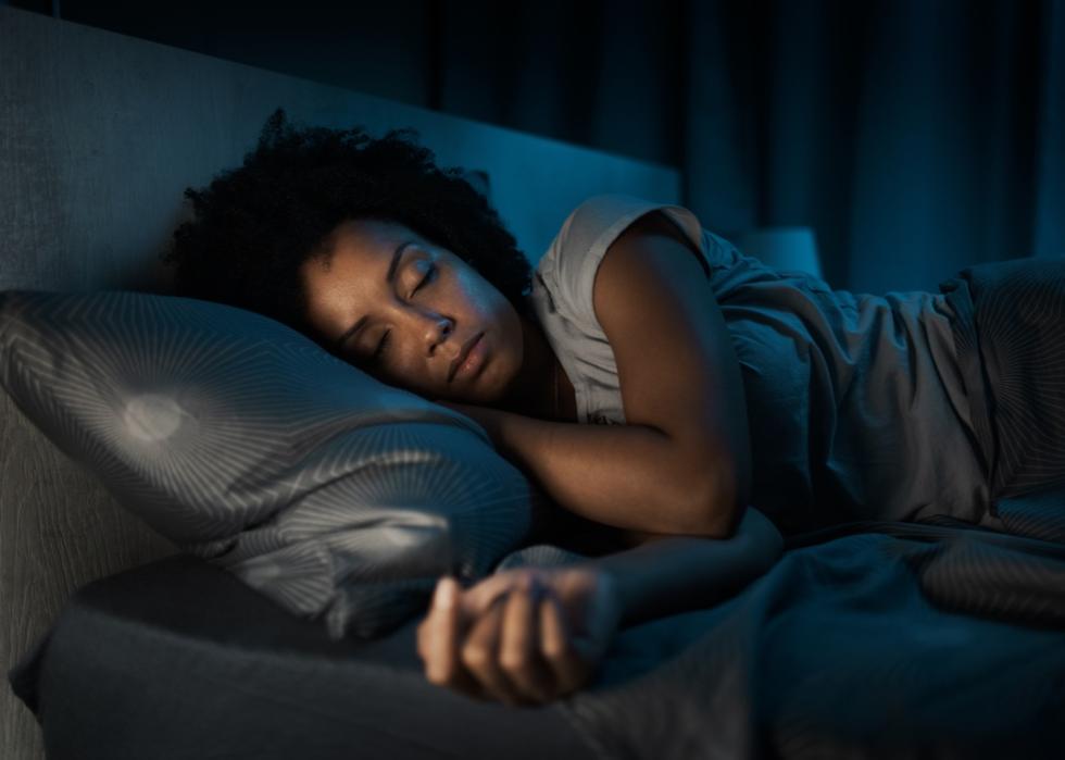 Woman sleeping peacefully in bed.