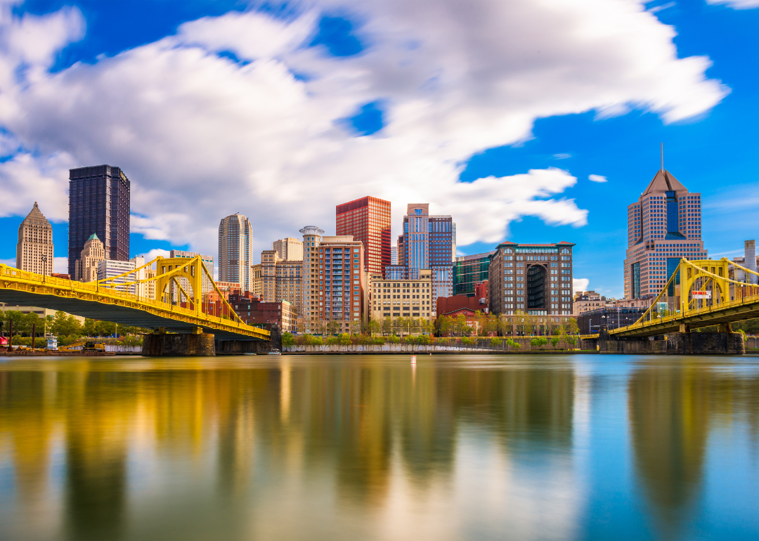 Two yellow bridges and the Pittsburgh skyline.