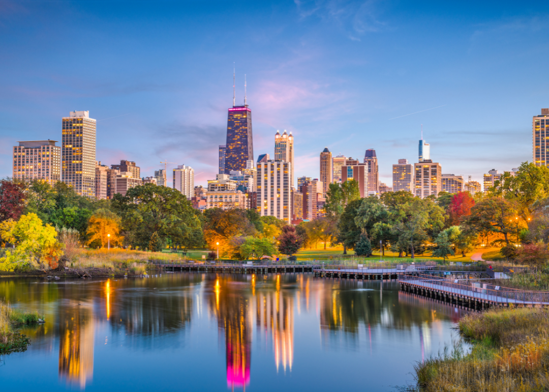 The Chicago skyline in the evening from a park.