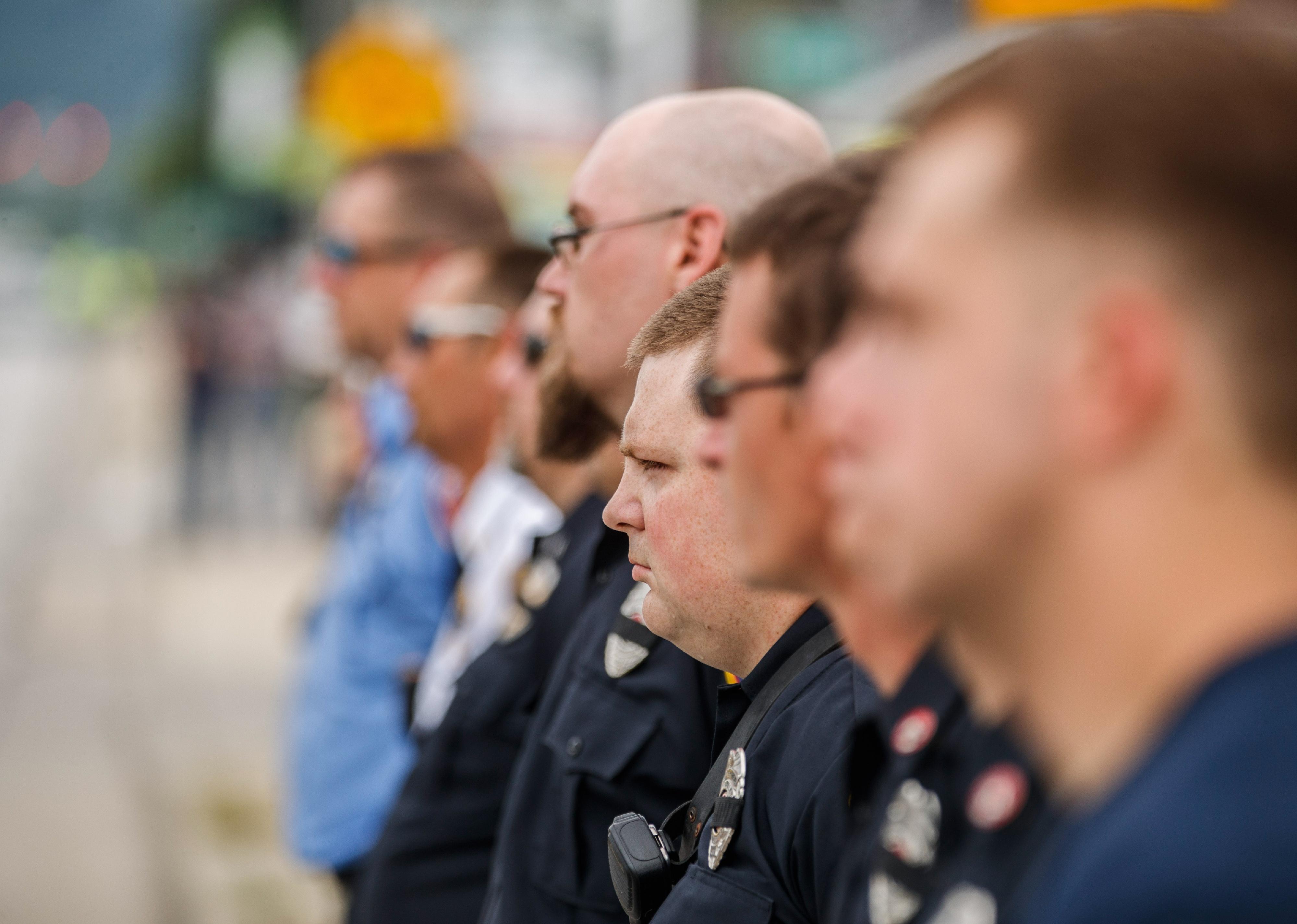 Firefighters lined up on the street in Bloomington, Indiana