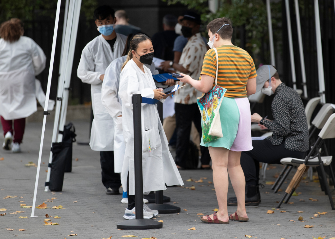 A person checking in to receive a vaccine.
