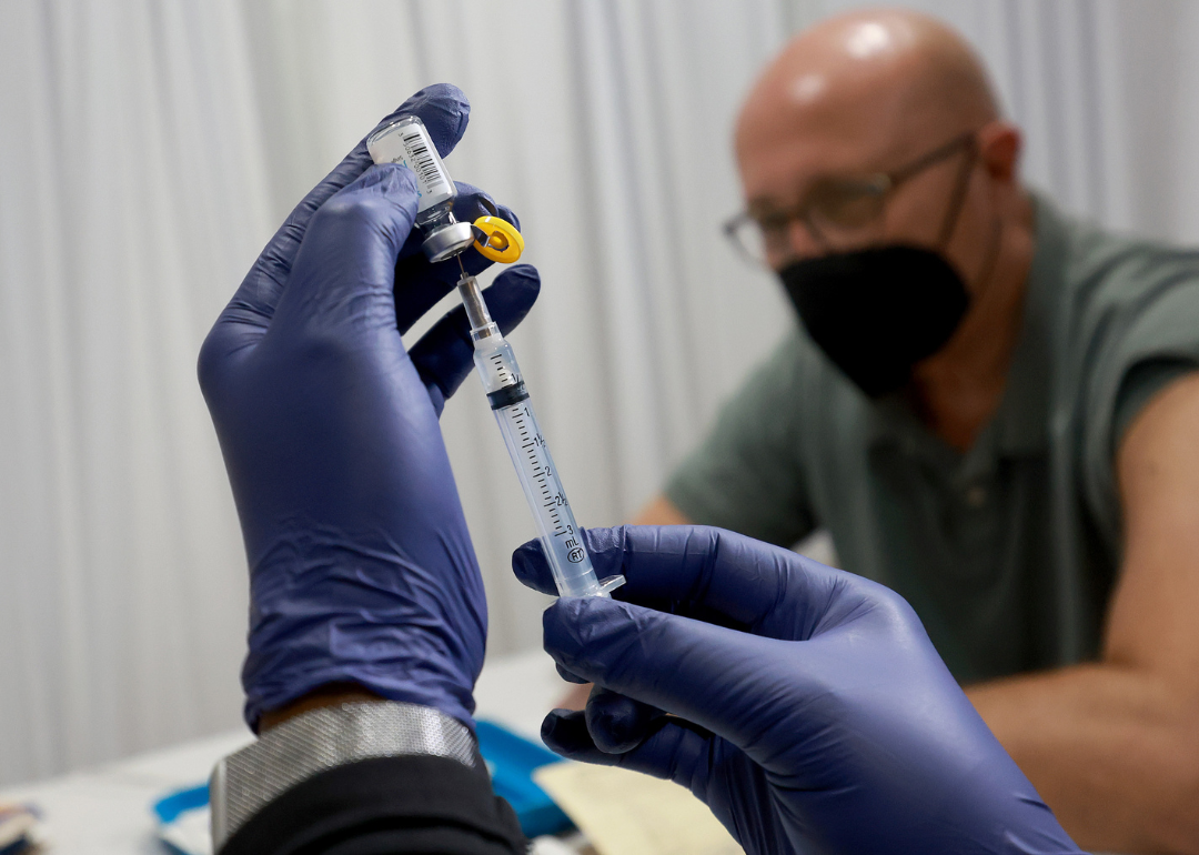 A healthcare worker prepares to administer a Monkeypox vaccine.