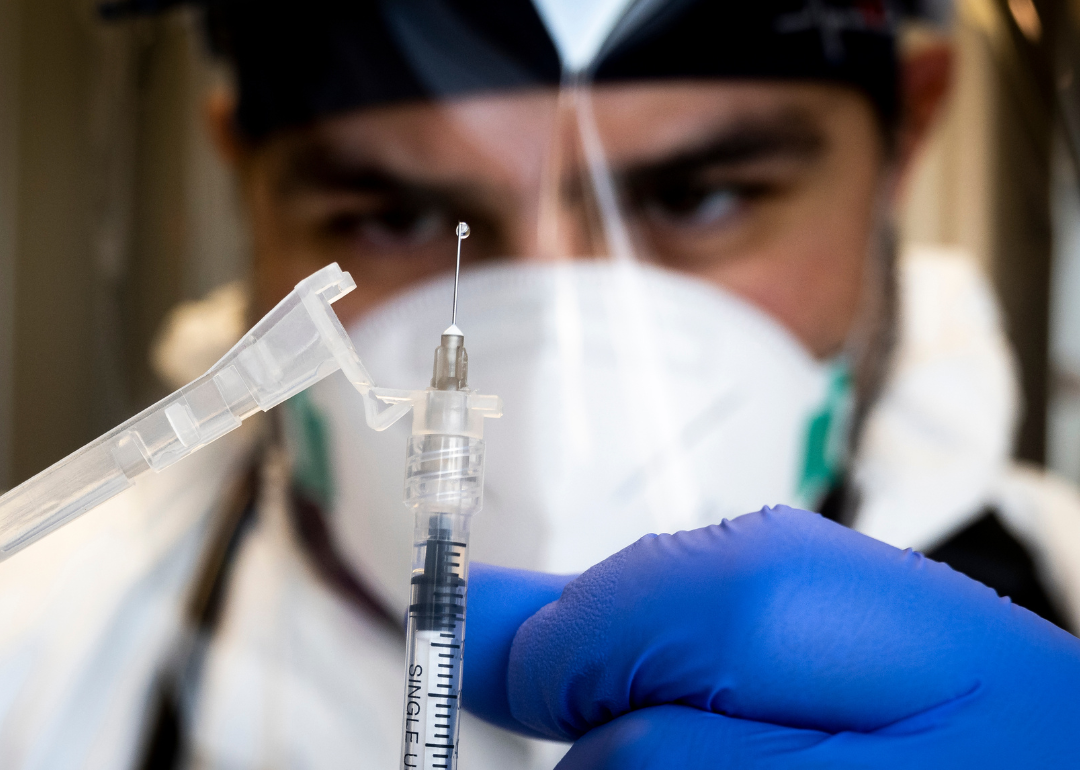 A healthcare worker preparing to administer a Monkeypox vaccine.