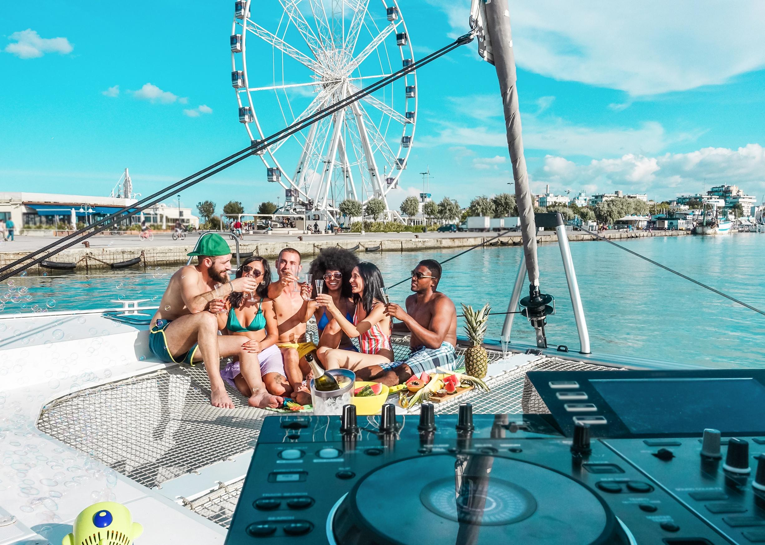 Friends drinking Champagne on a boat.