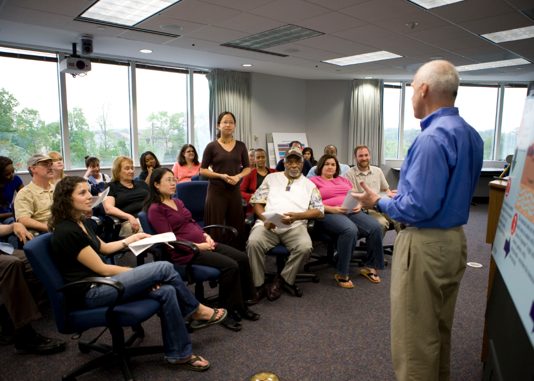 A group of people meeting to discuss hazardous soil substances.