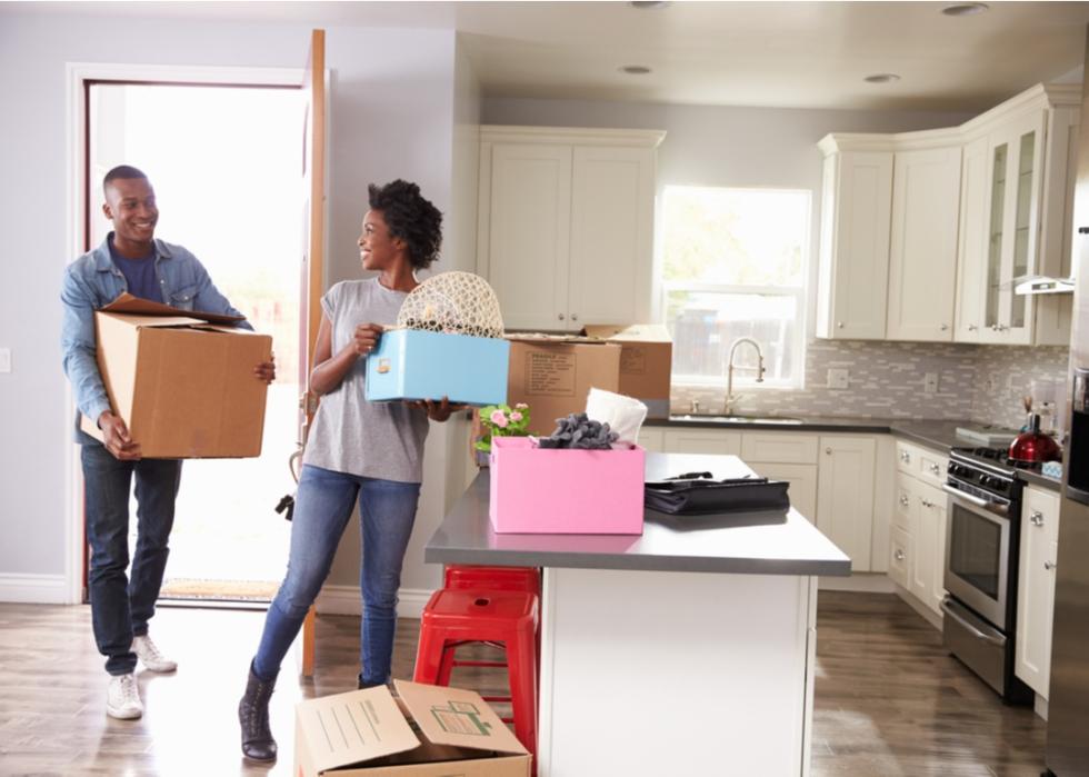 Man and woman moving into new place.