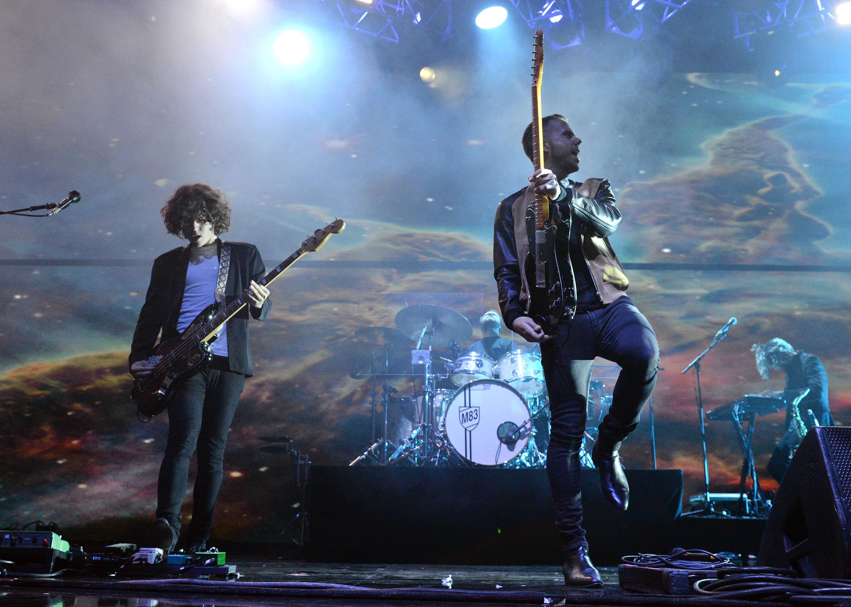 M83 performing onstage.