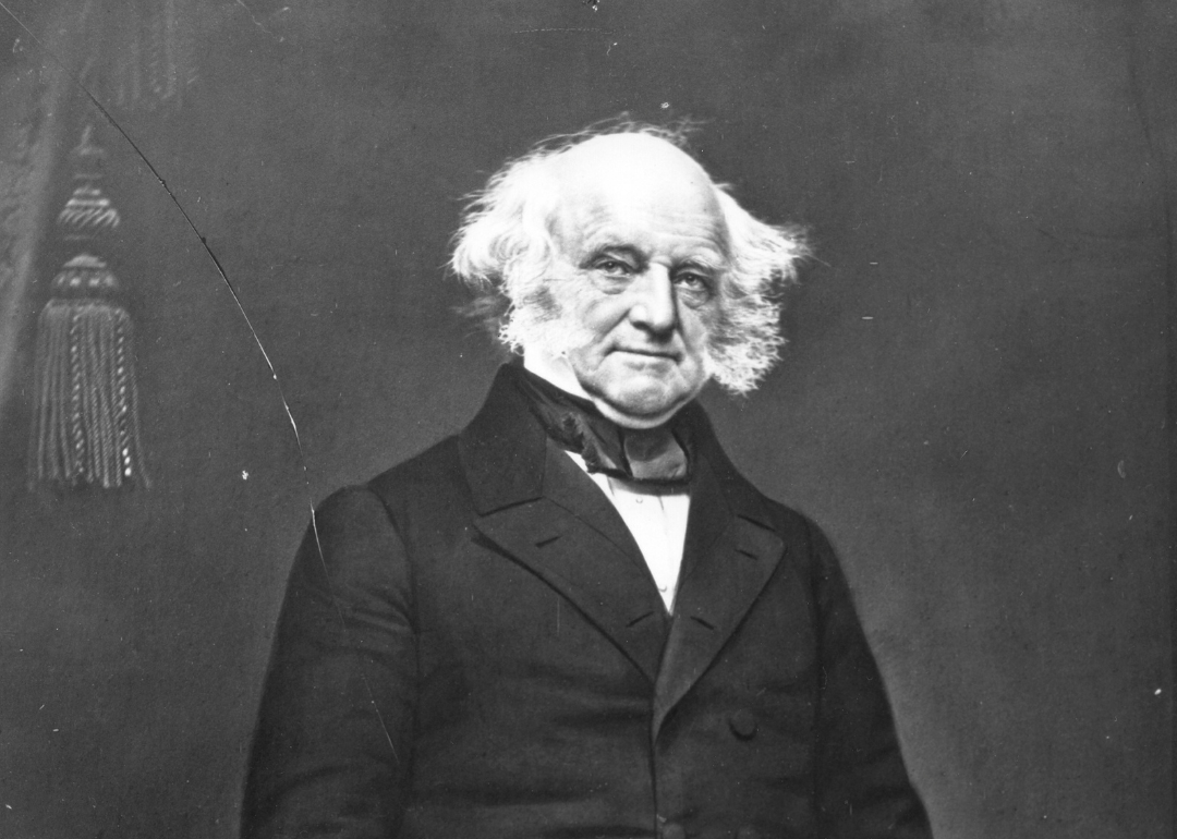 Martin Van Buren in a dark suit jacket.