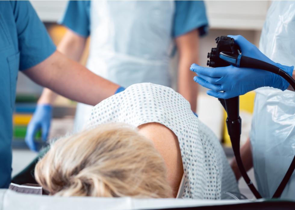 Patient and doctors during colonoscopy.