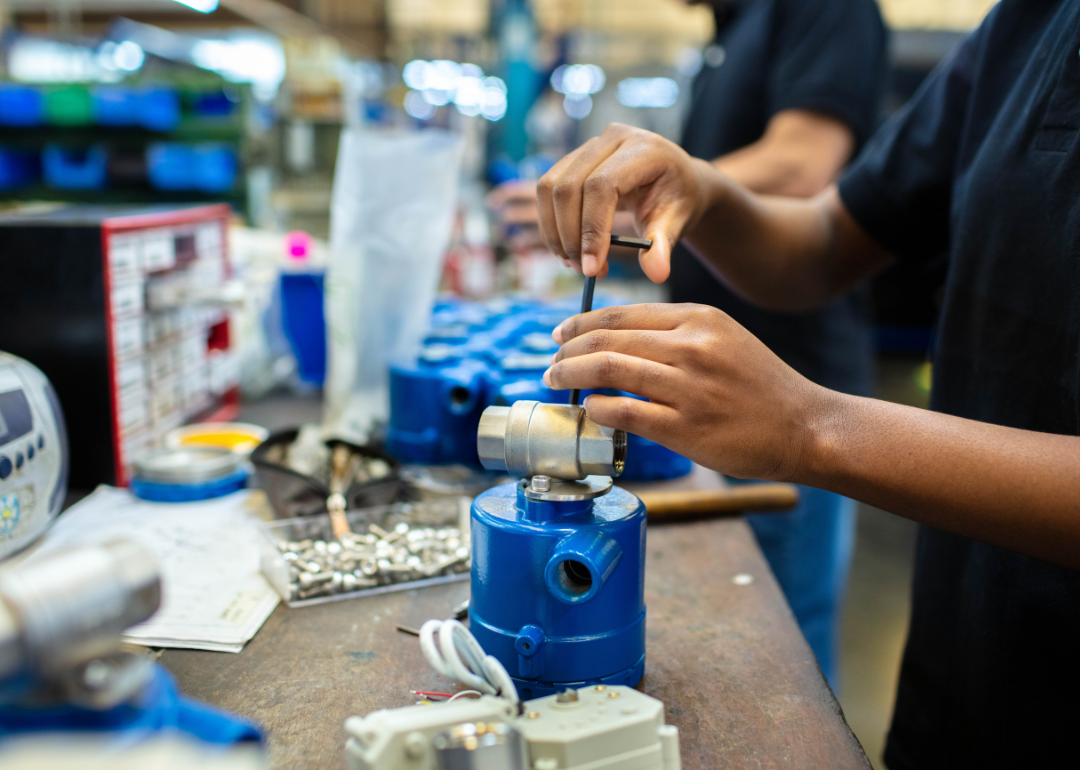 Production line workers assembling products.