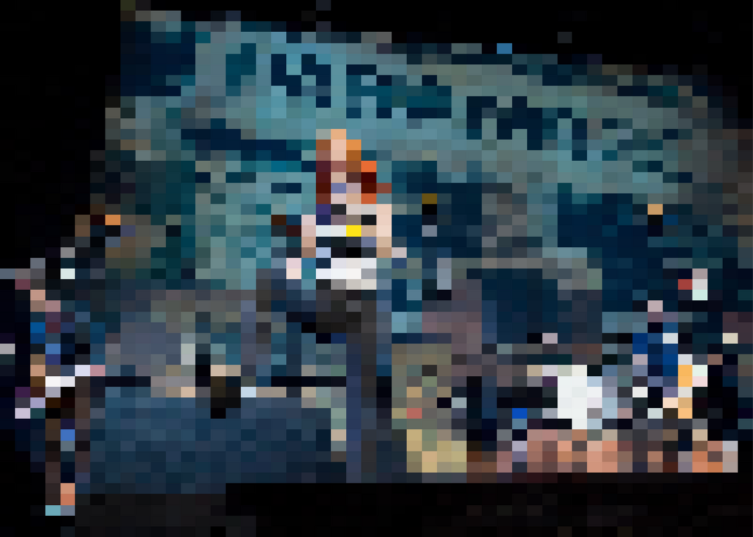 Josh Farro, Hayley Williams, Zac Farro, and Jeremy Davis of Paramore perform in concert.