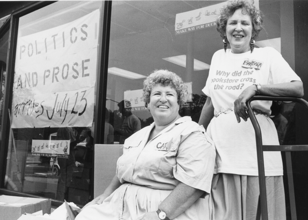Carla Cohen and Barbara Meade in front of their bookstore