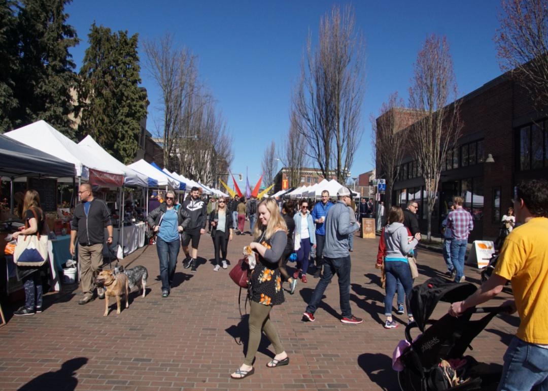 People exploring the Ballard farmers market.
