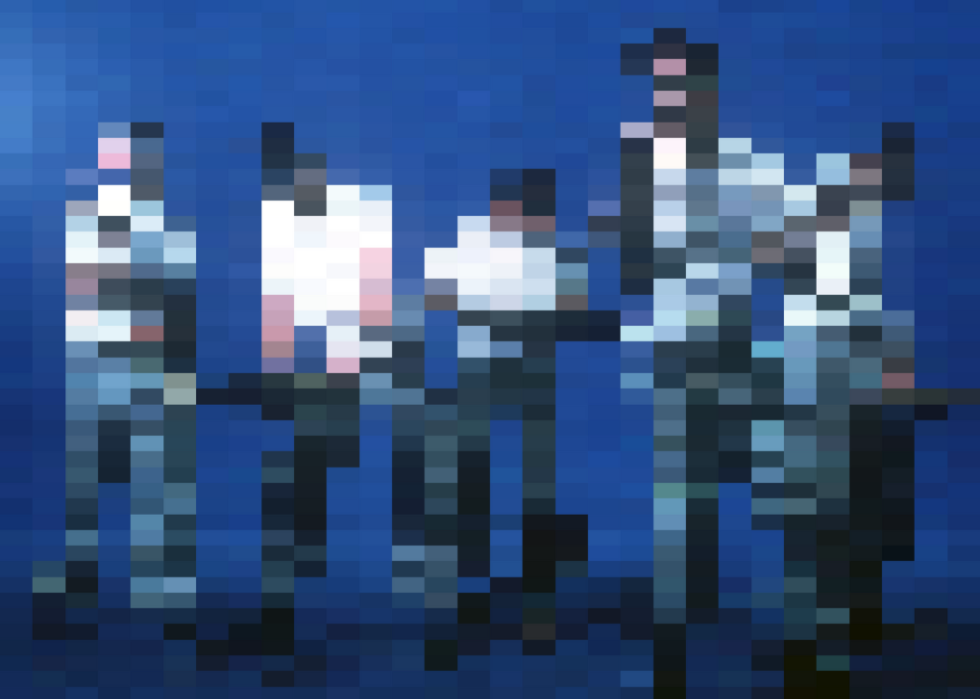 Alan Myers, Bob Mothersbaugh, Bob Casale, Mark Mothersbaugh and Gerald Casale of the group "Devo" pose for a portrait.