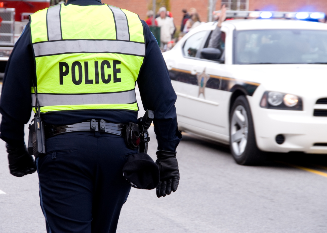 A police officer walking toward a scene.
