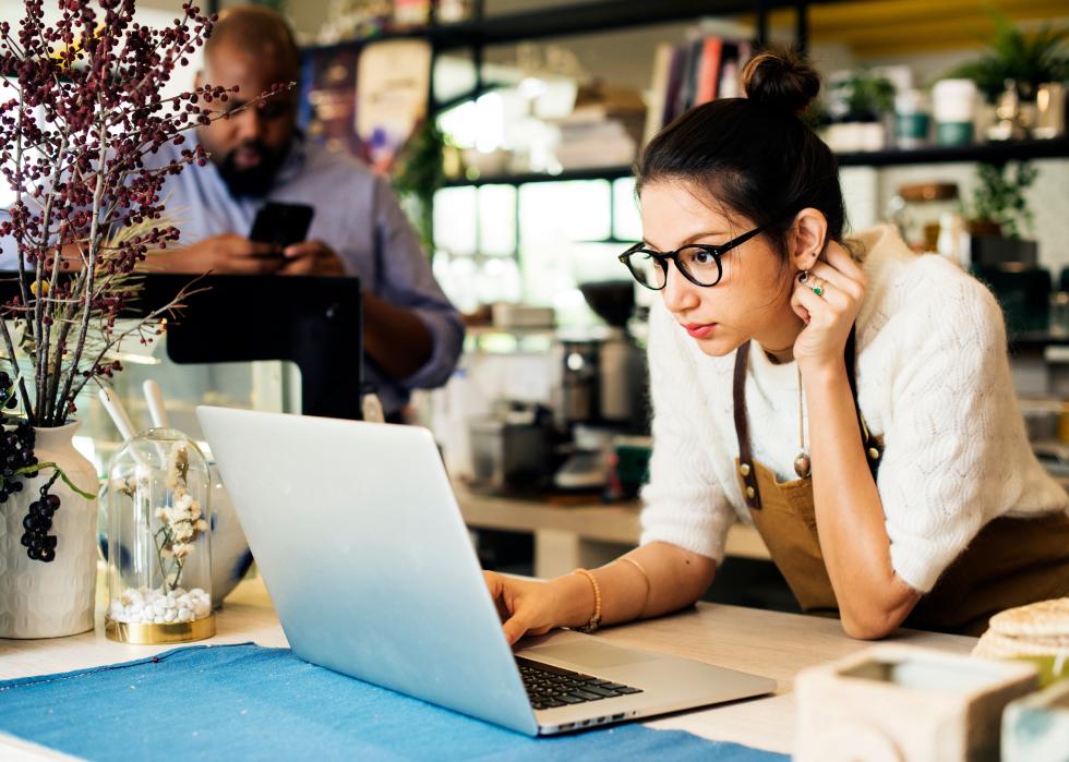 Female business owner using laptop