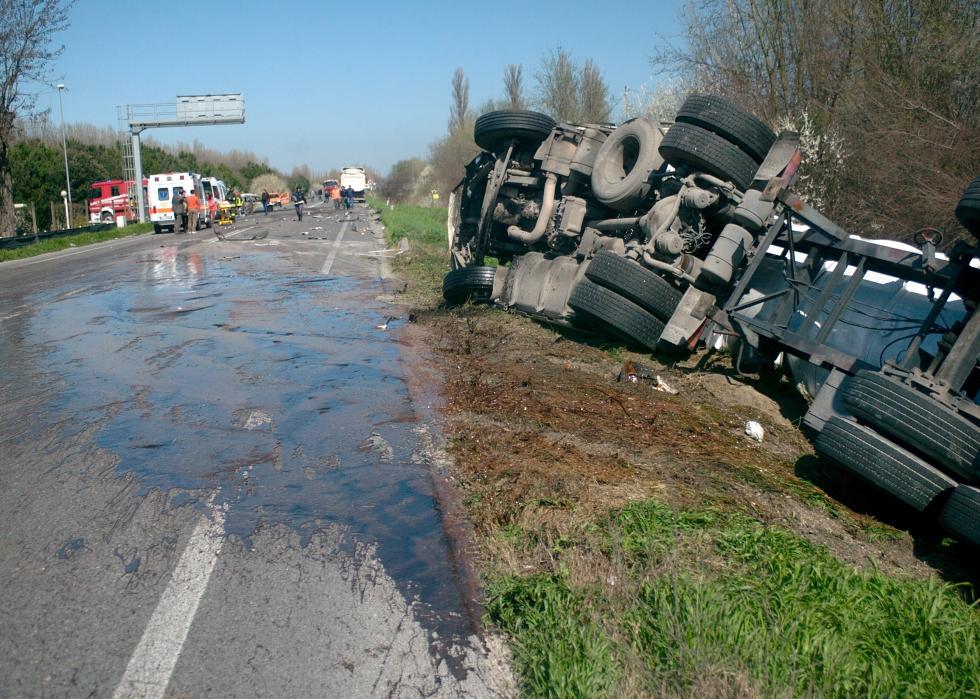 Overturned truck on the side of the road