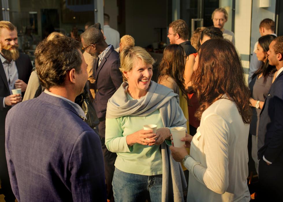 Diverse people mingling at an event.