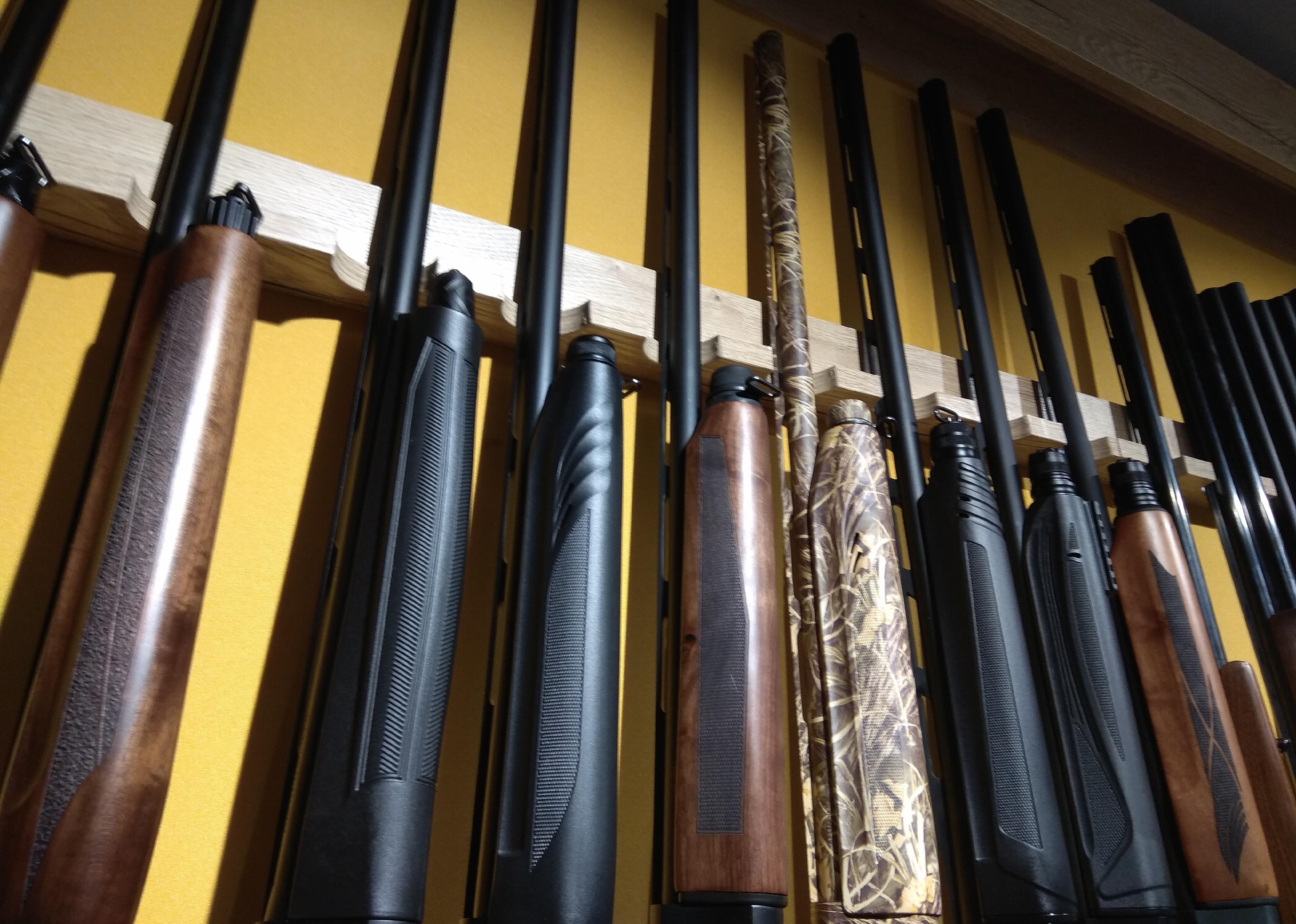 Showcase of a gun shop with rifles.