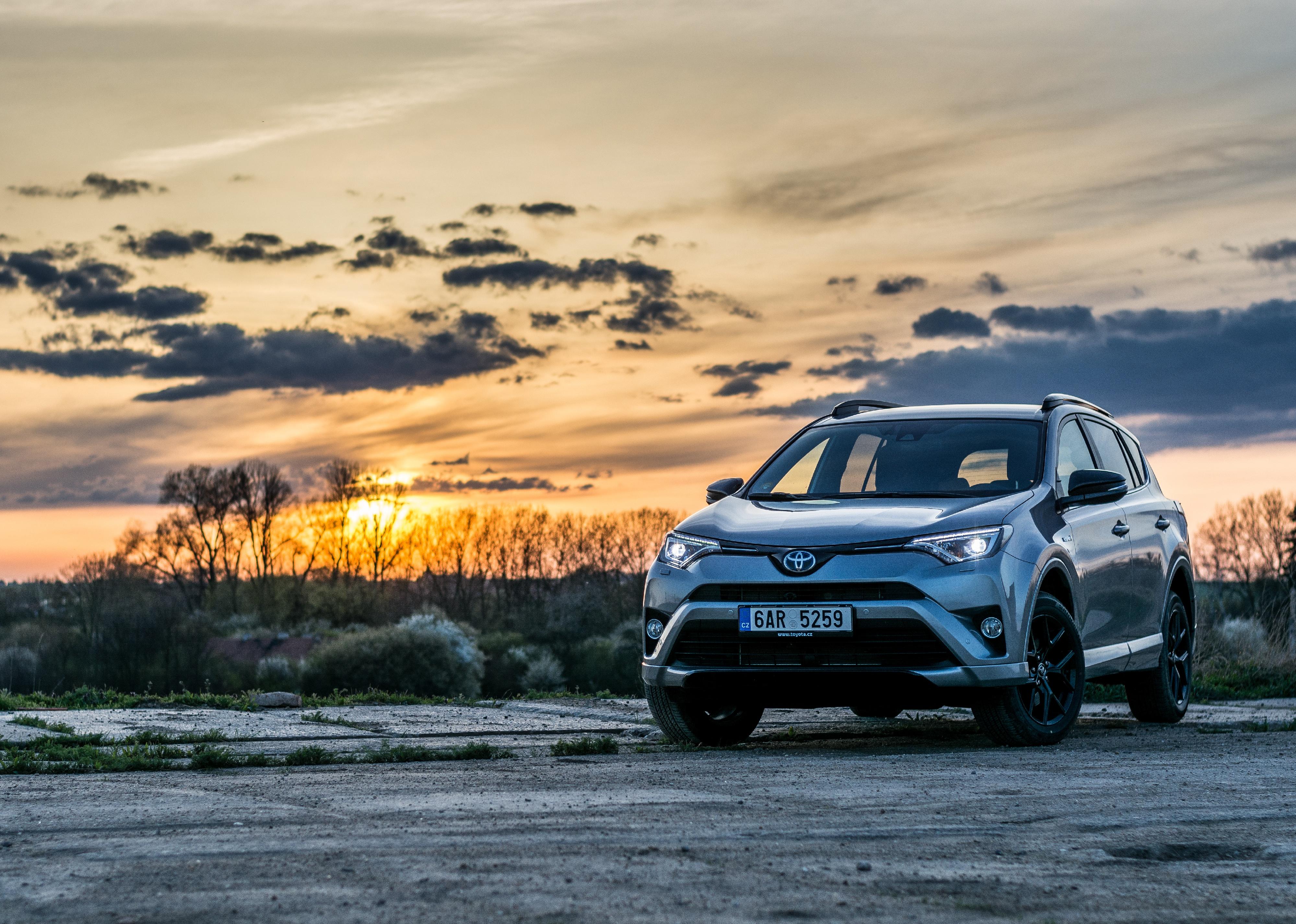 Toyota RAV4 Hybrid with a sunset.