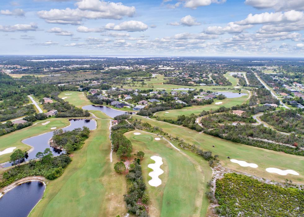 Aerial view of golf course and residential homes.