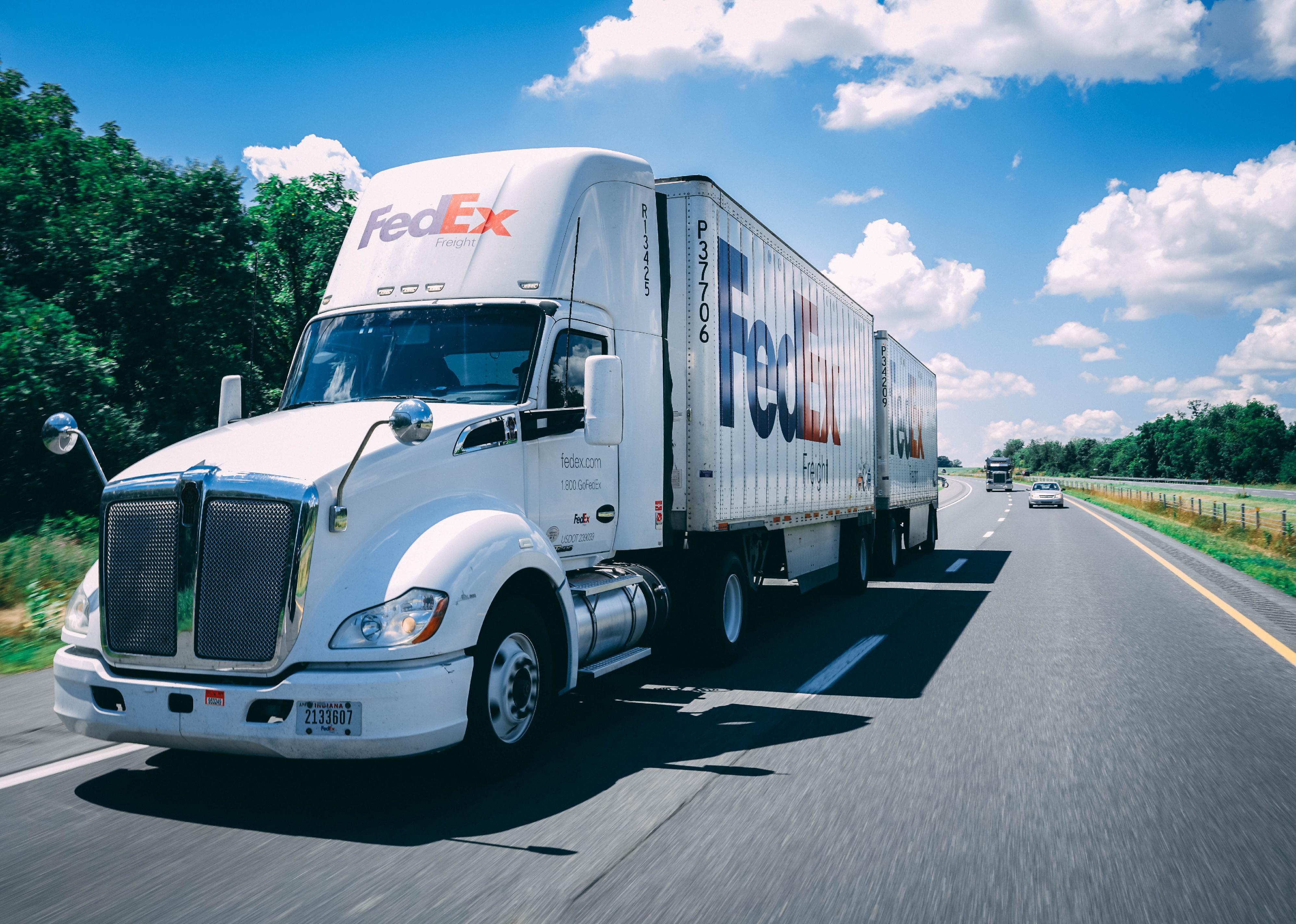 FedEx truck on the highway.
