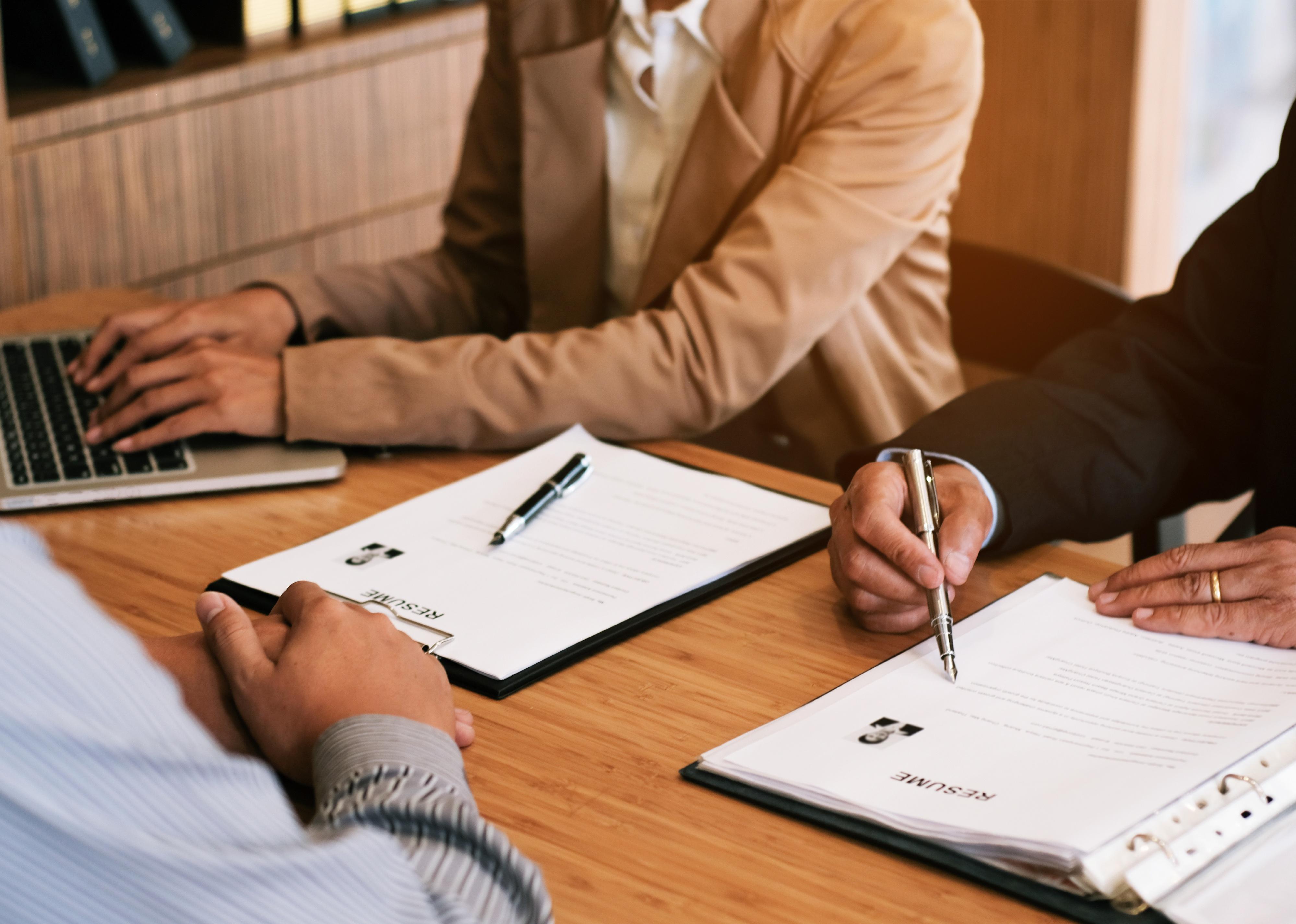 Employer reading a resume during job interview