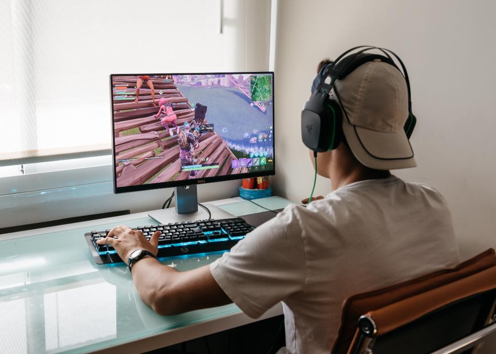 Back view of a boy playing Fortnite.
