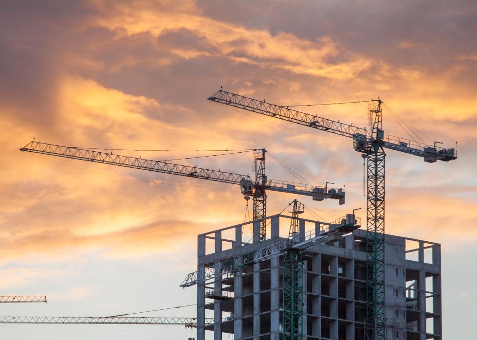 Construction site with cranes against the background.