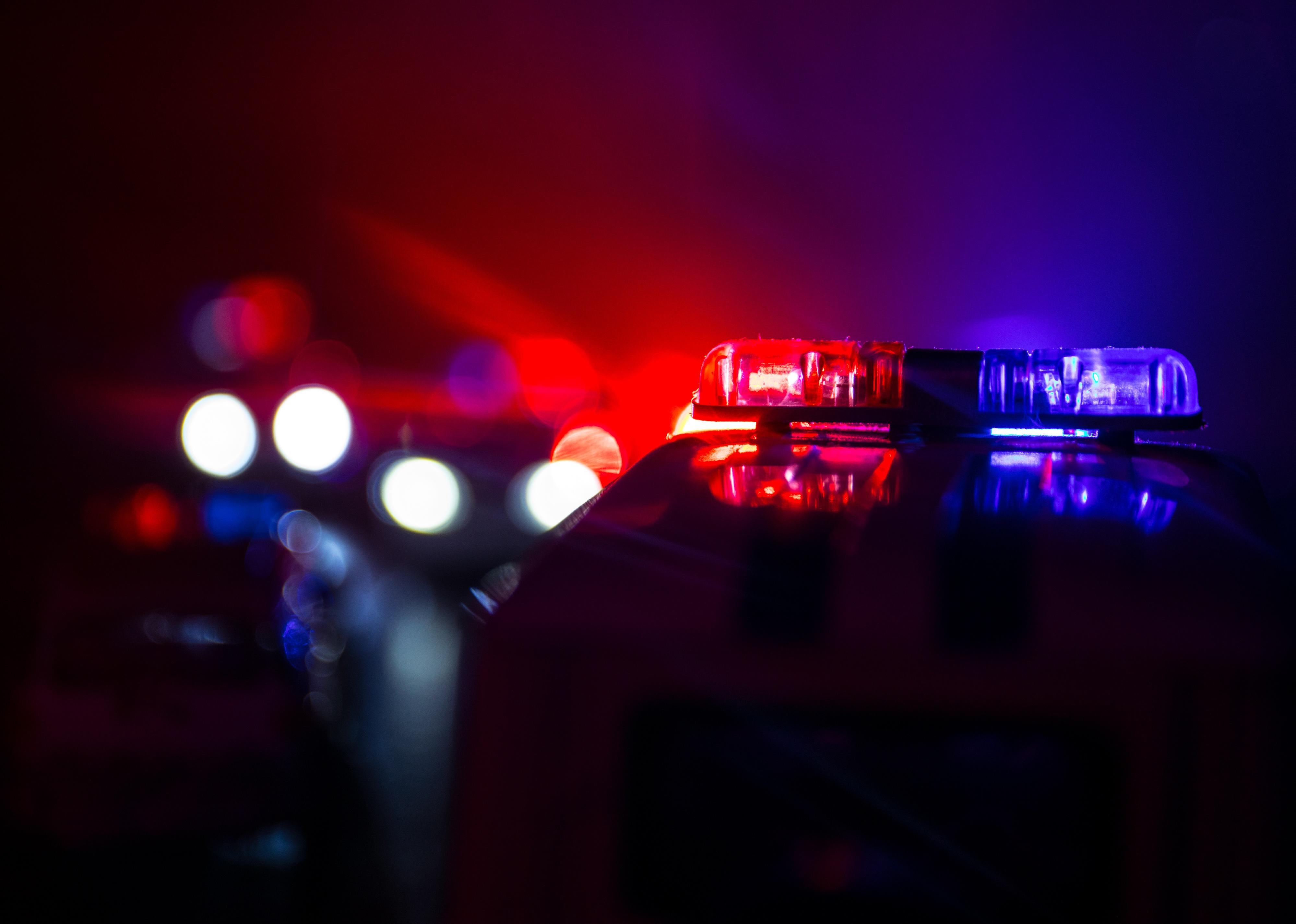 Police cars at night.