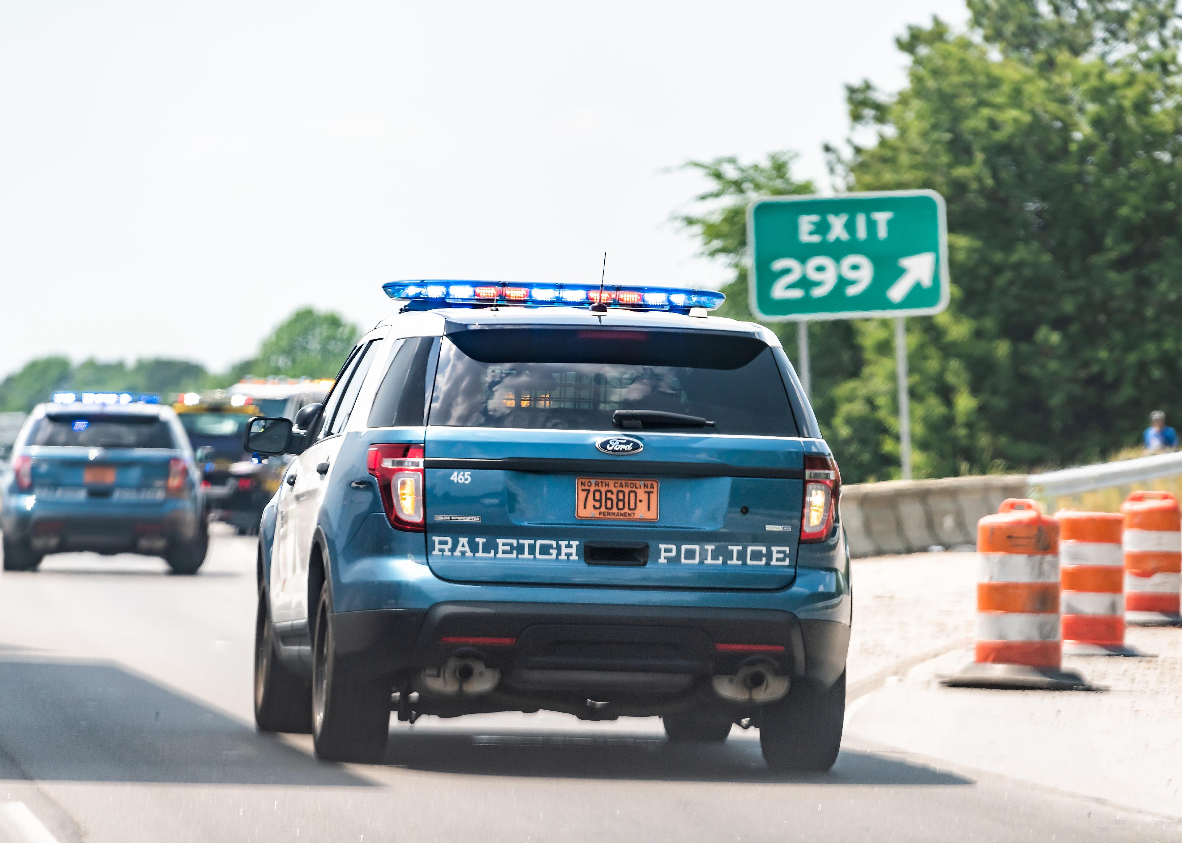 Highway road in North Carolina with closeup of traffic police car.
