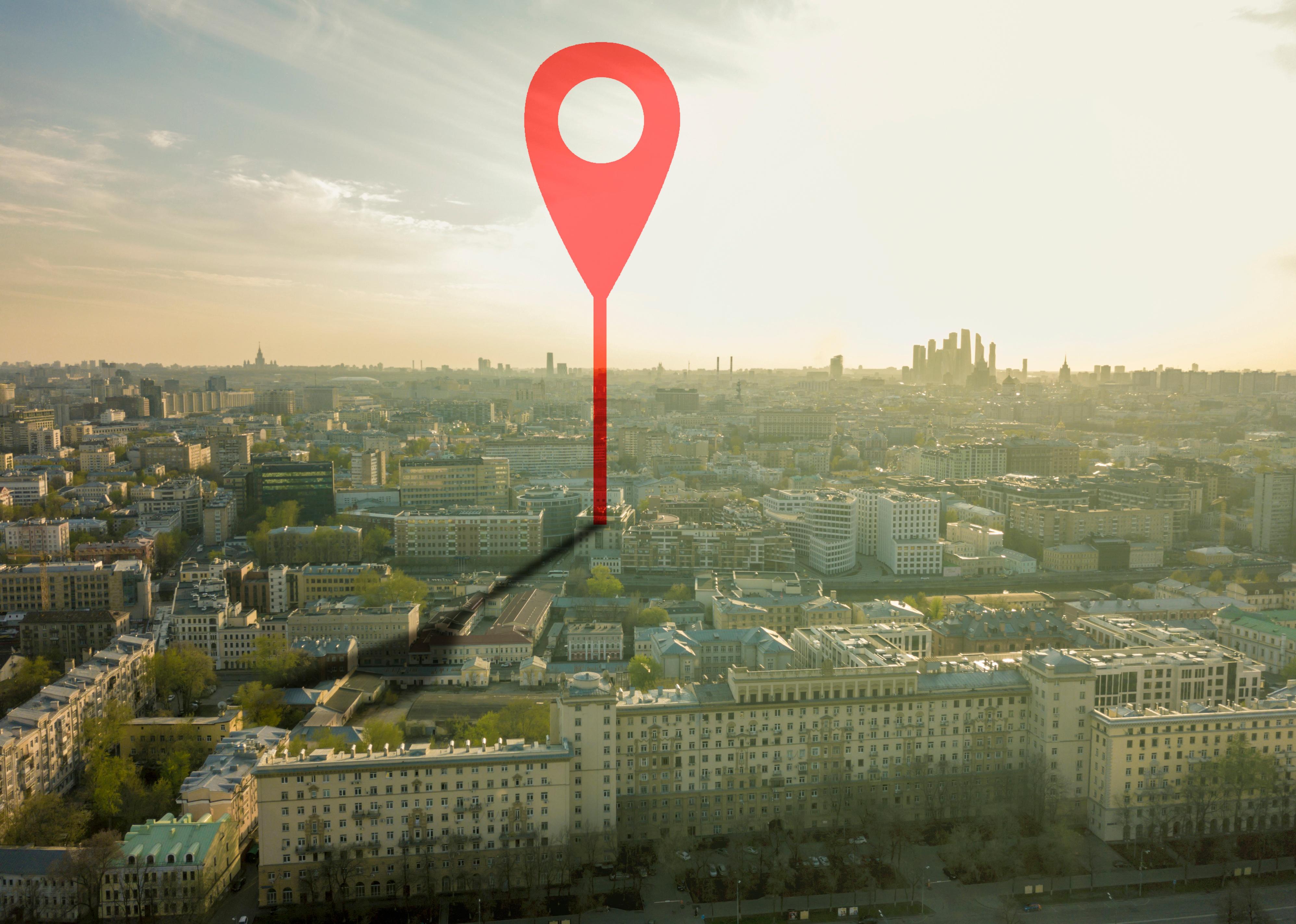 Aerial shot of marker pointing on the streets of a city.