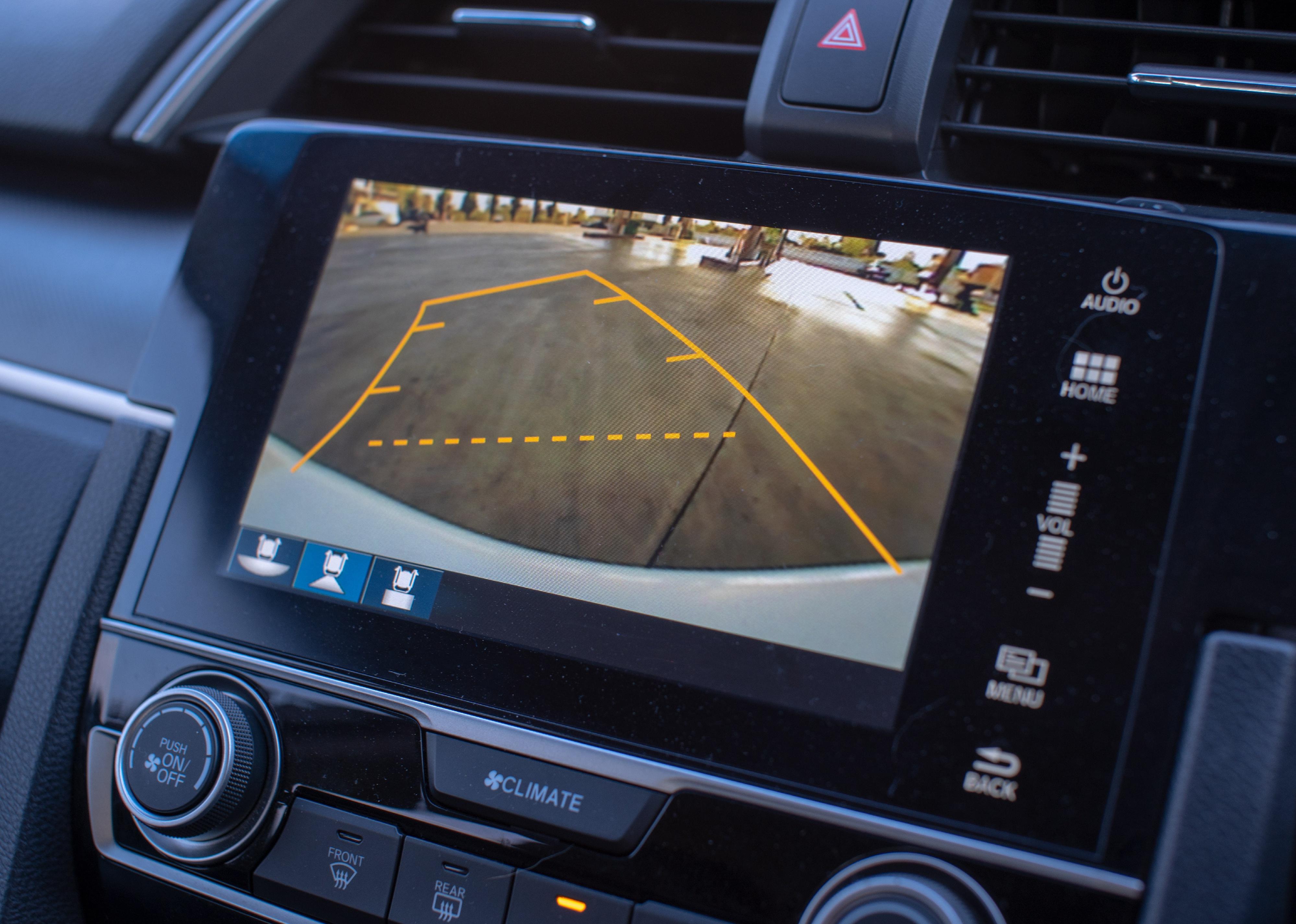 Car rear-view monitor on dash.