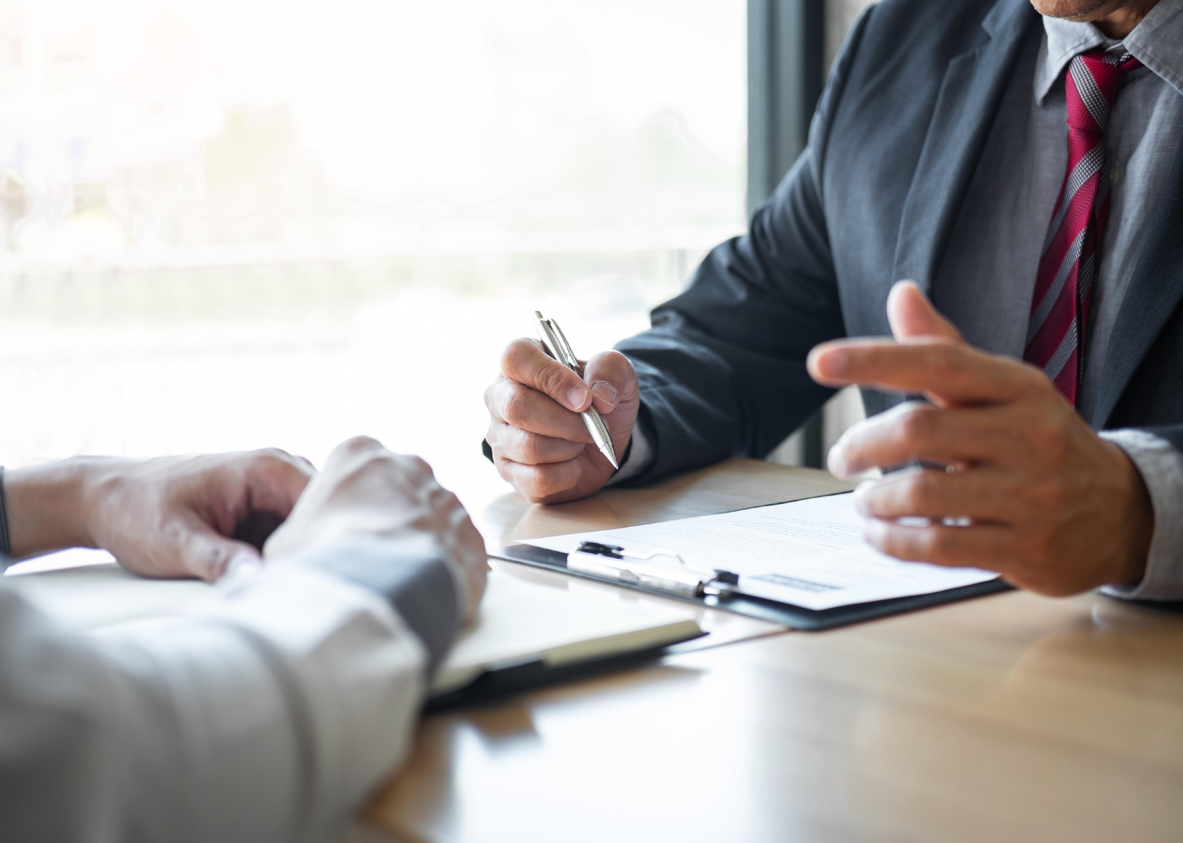 Man in suit is conducting a job interview