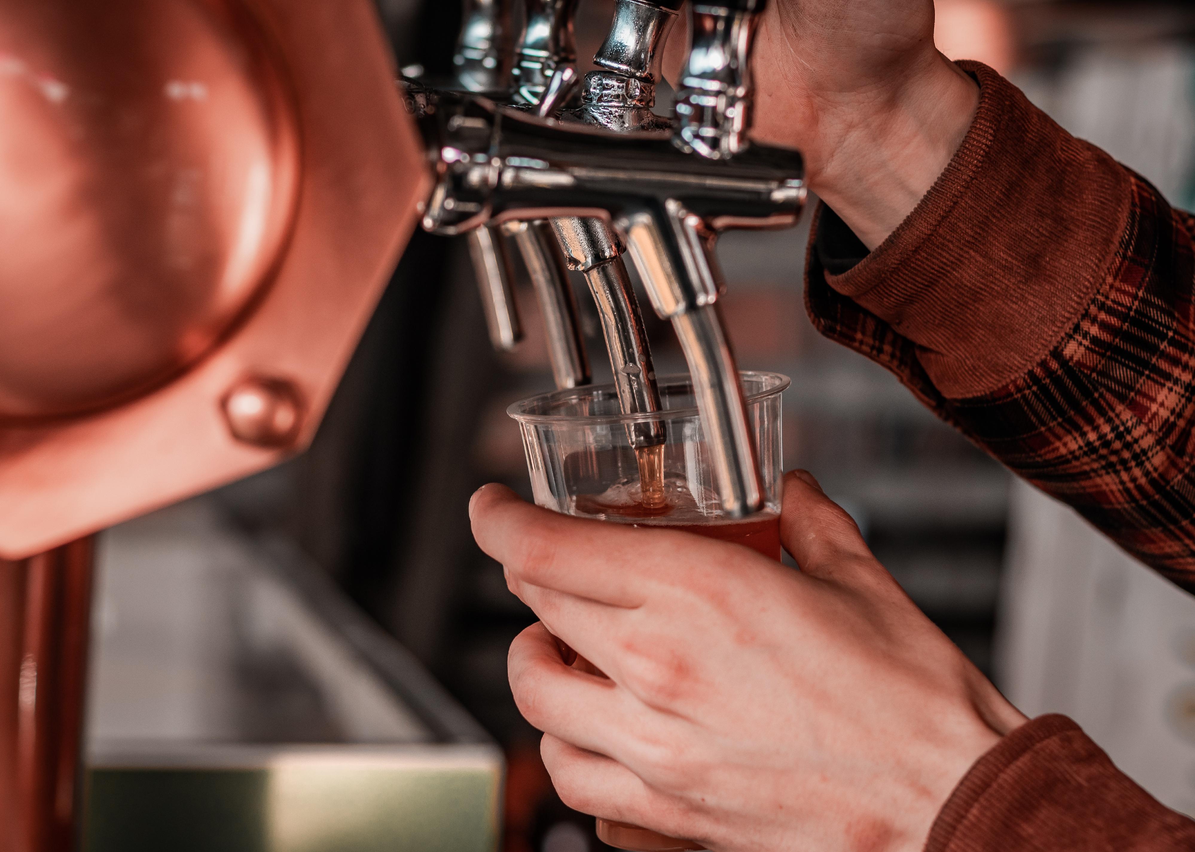 Close up of beer pour from tap