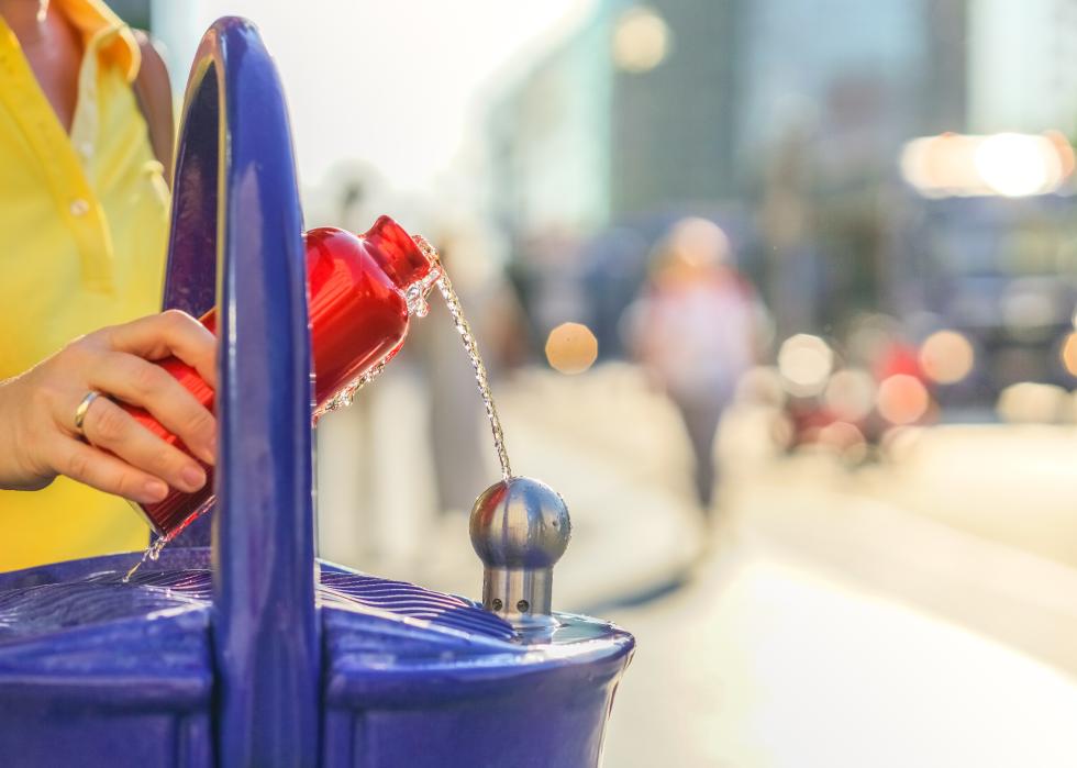 Traveler refills a bottle of drinking water