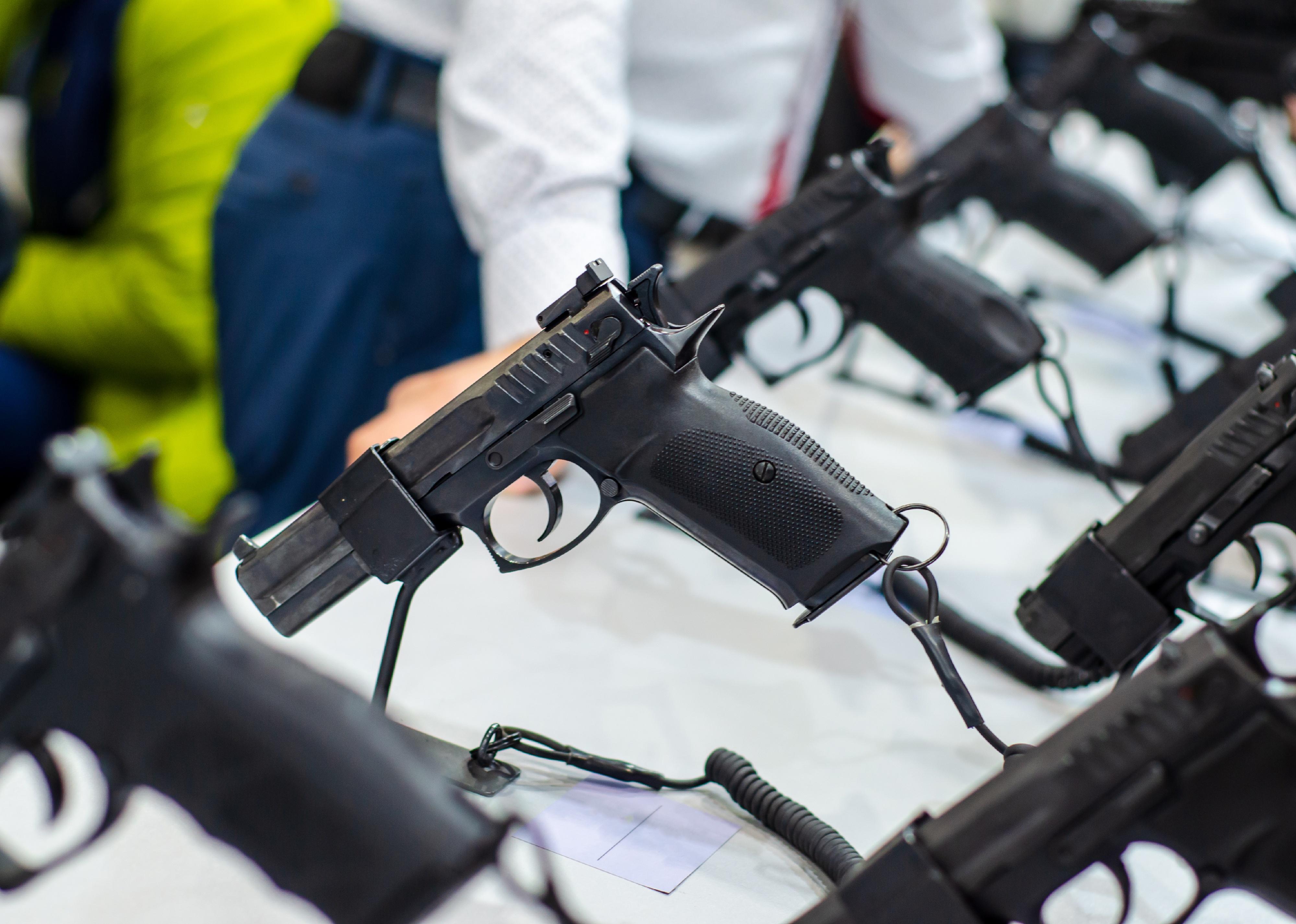 Close up of a display of guns for sale in a store.