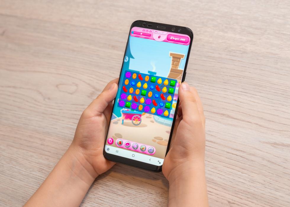 Candy Crush Saga puzzle game on smartphone.