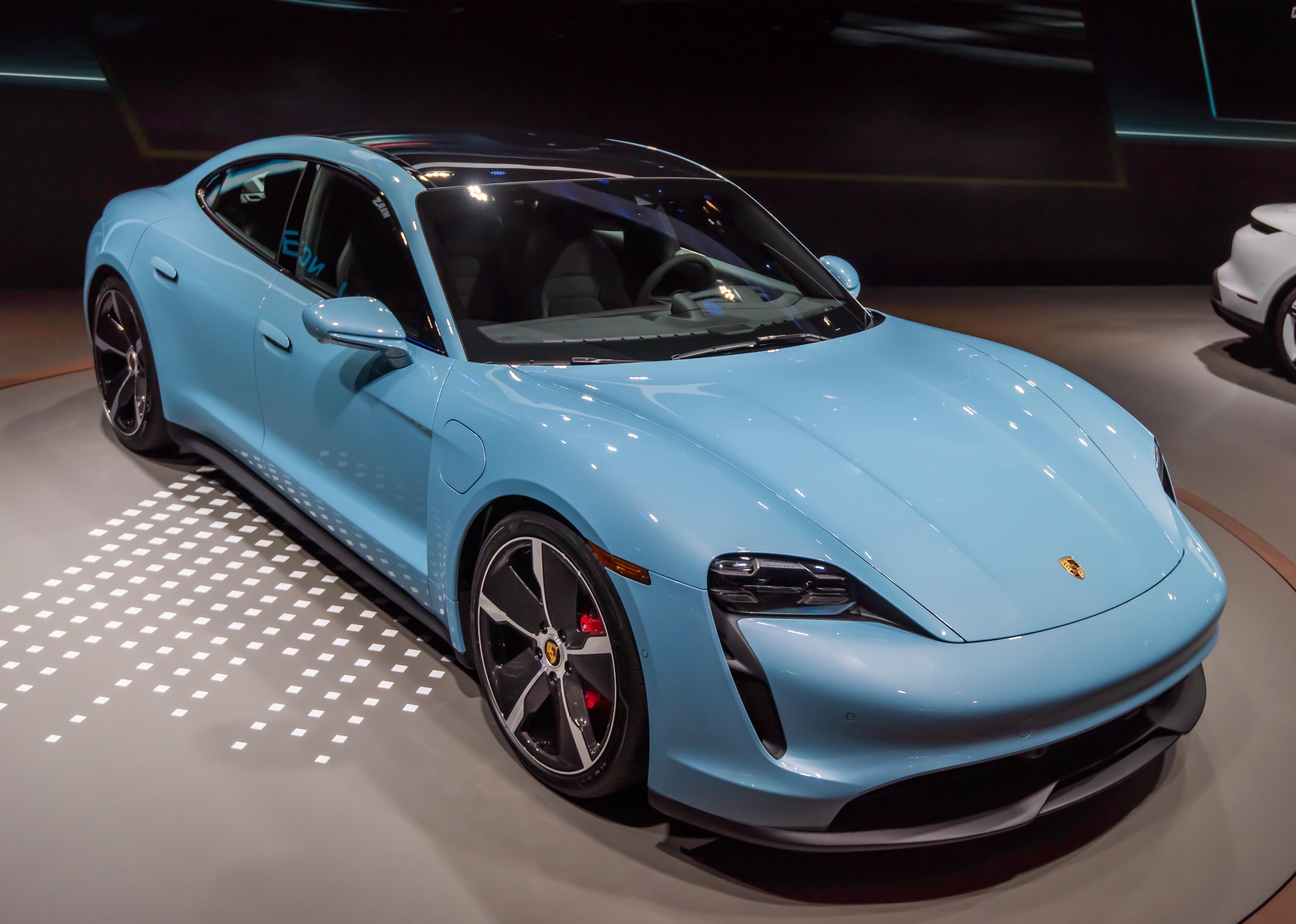 A Porsche Taycan 4S electric car with carbon fiber wheels.